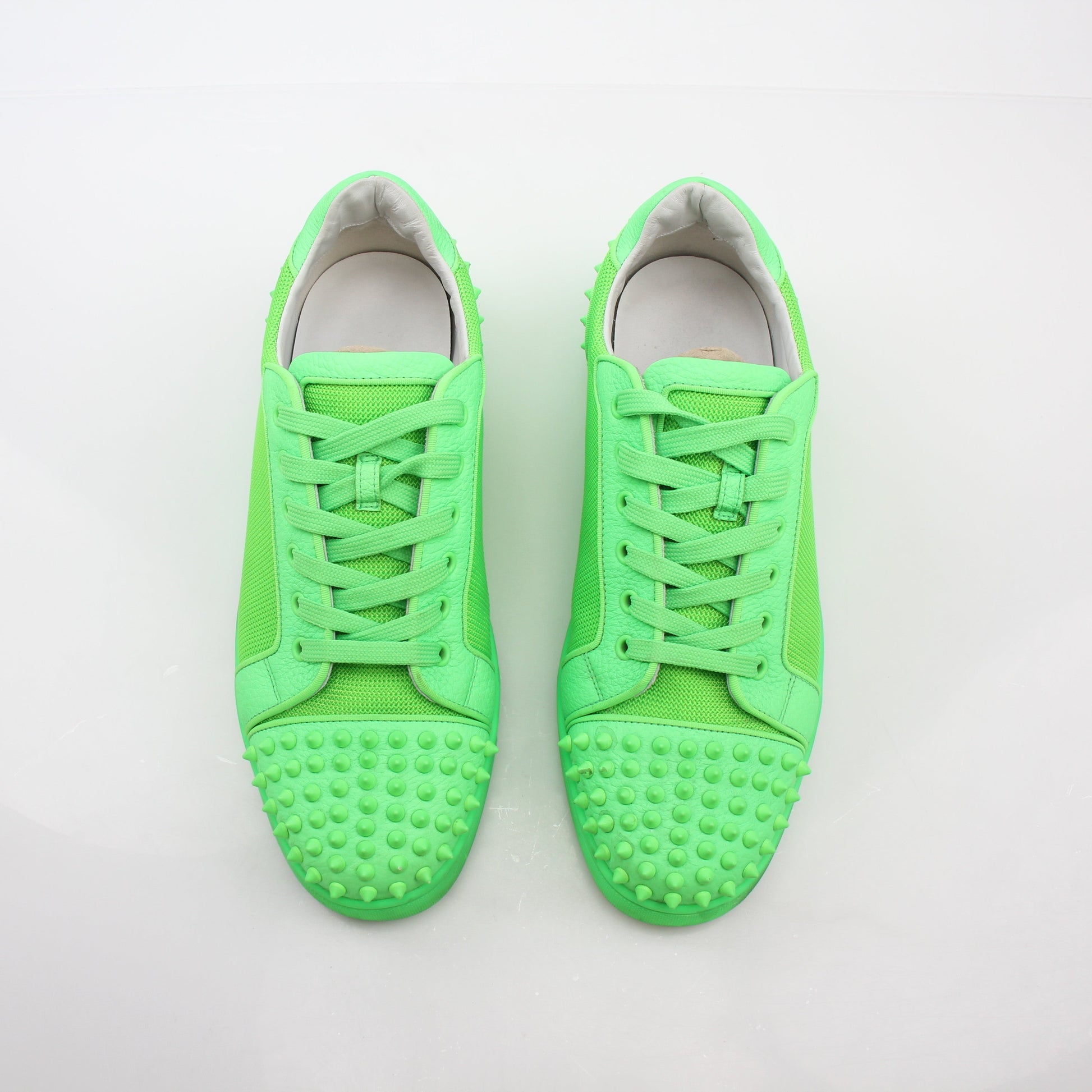 Christian Louboutin Green Seavaste 2 Orlato sneakers by Gold & Beyond, featuring vibrant green shoes with signature design details.