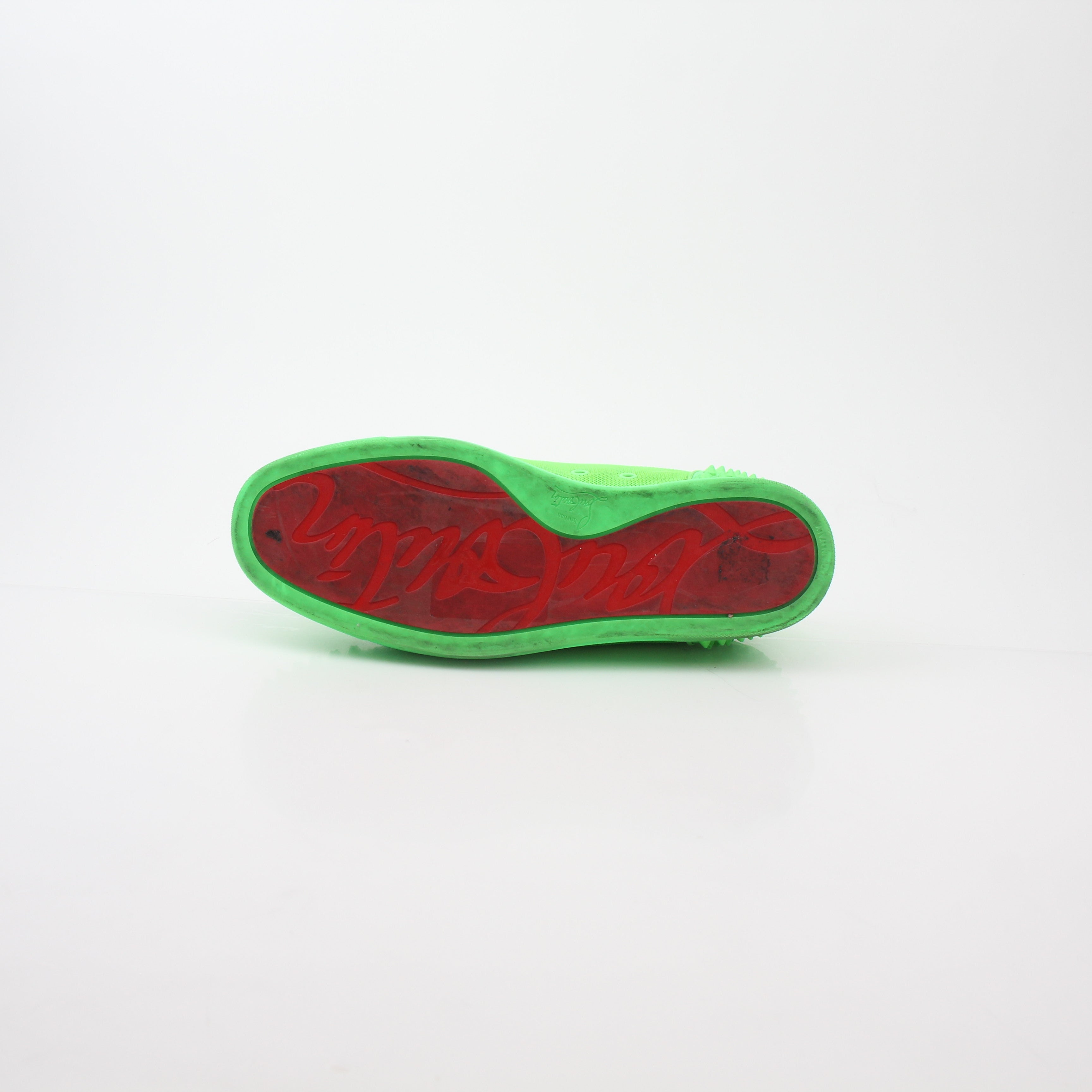 Christian Louboutin Green Seavaste 2 Orlato sneakers with green and black design, featuring signature red soles and stylish details.