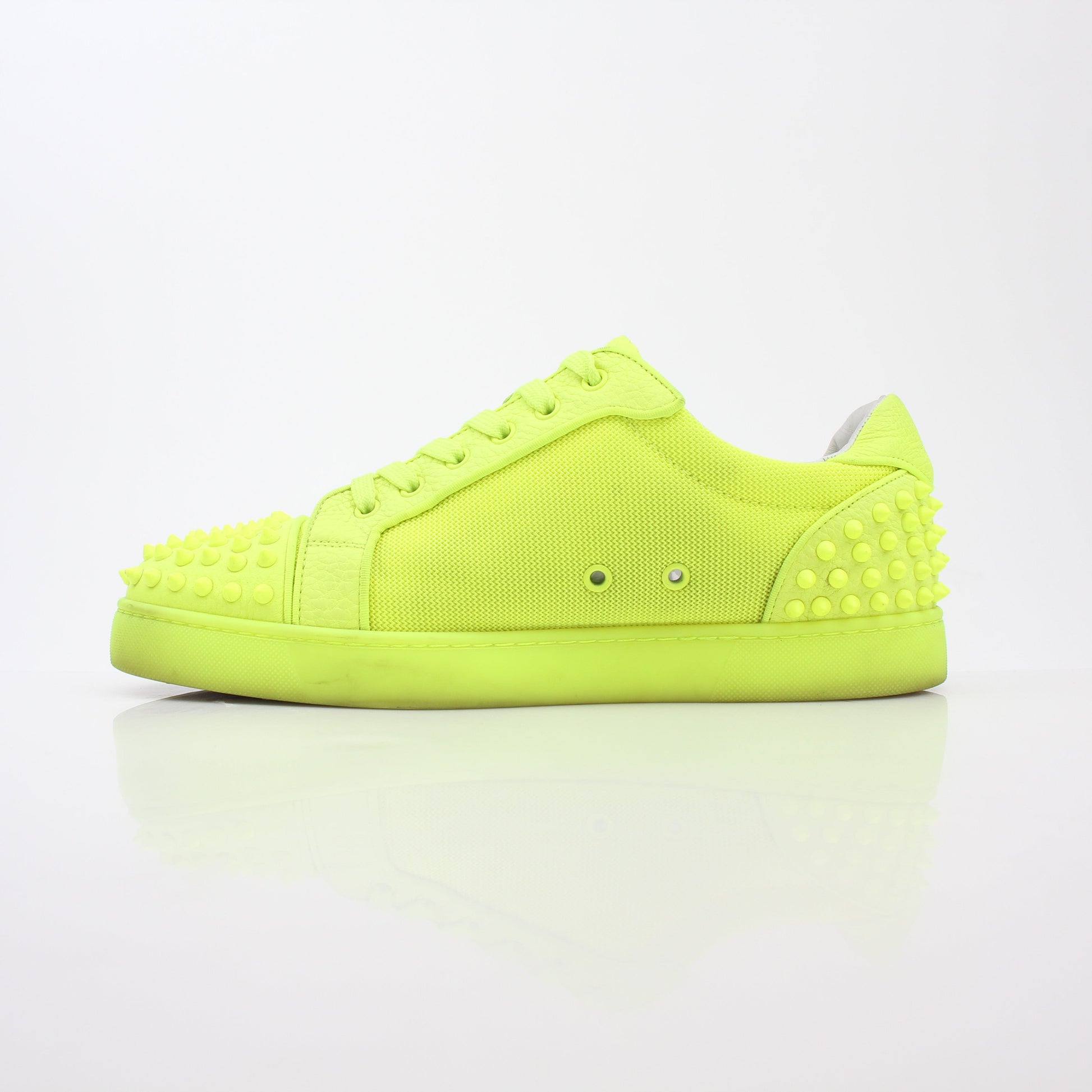 Christian Louboutin Neon Yellow Seavaste 2 Orlato sneakers with black soles and signature style, displayed on a white background.