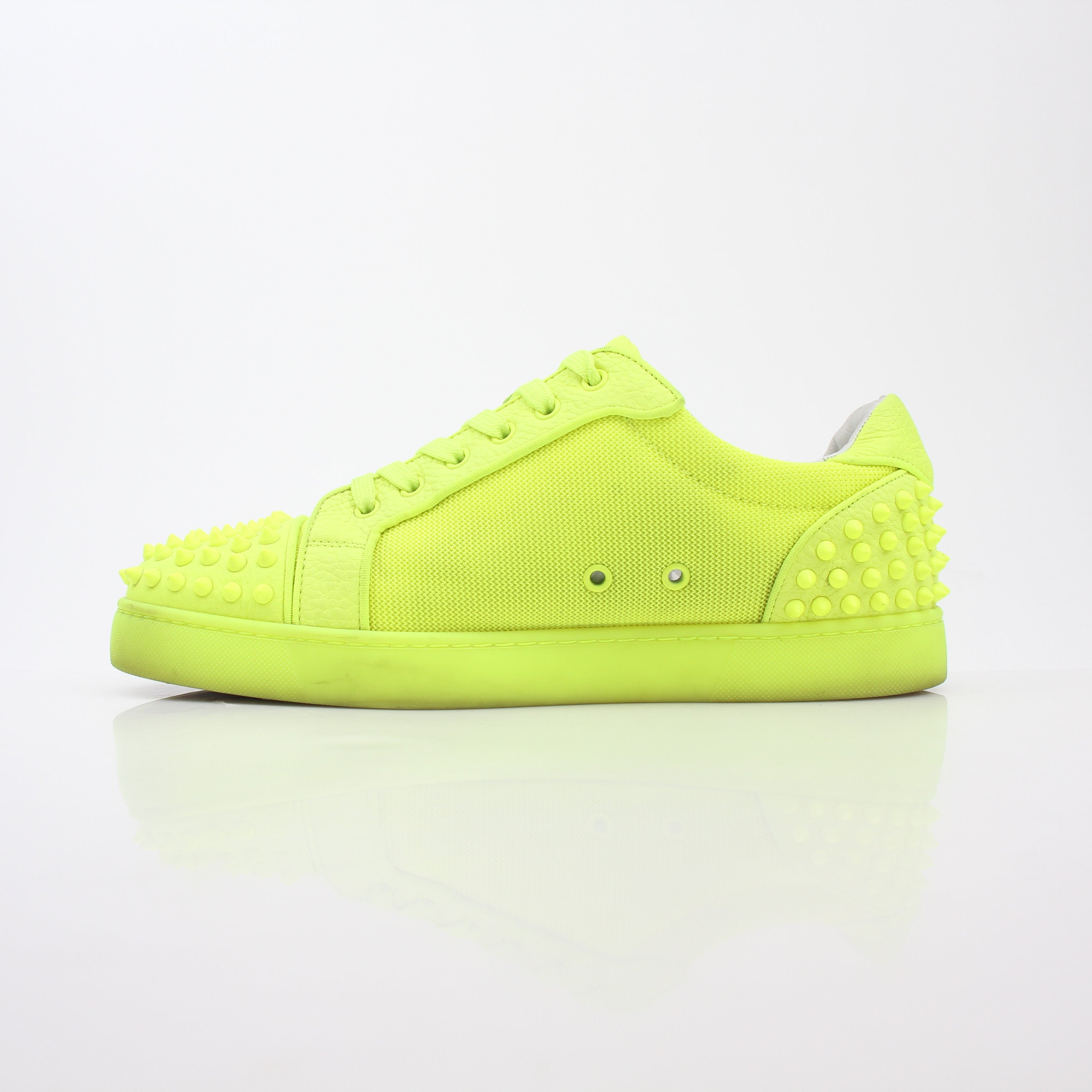 Christian Louboutin Neon Yellow Seavaste 2 Orlato sneakers with black soles and signature style, displayed on a white background.