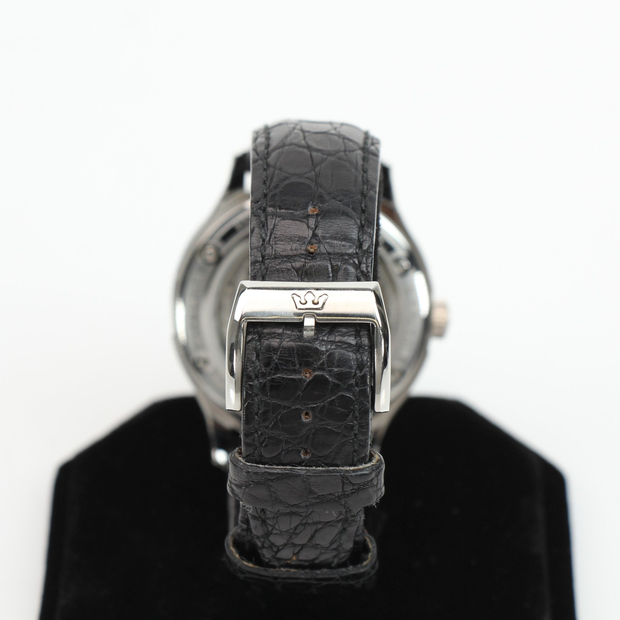 Marvin automatic dress watch by Gold & Beyond showing a sleek gold-tone case, white dial, and leather strap.