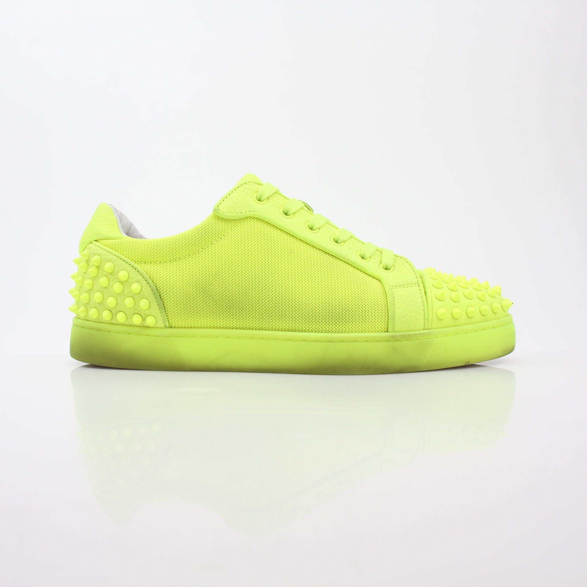 Christian Louboutin Neon Yellow Seavaste 2 Orlato sneakers with sleek design and vibrant color, displayed on a white background.