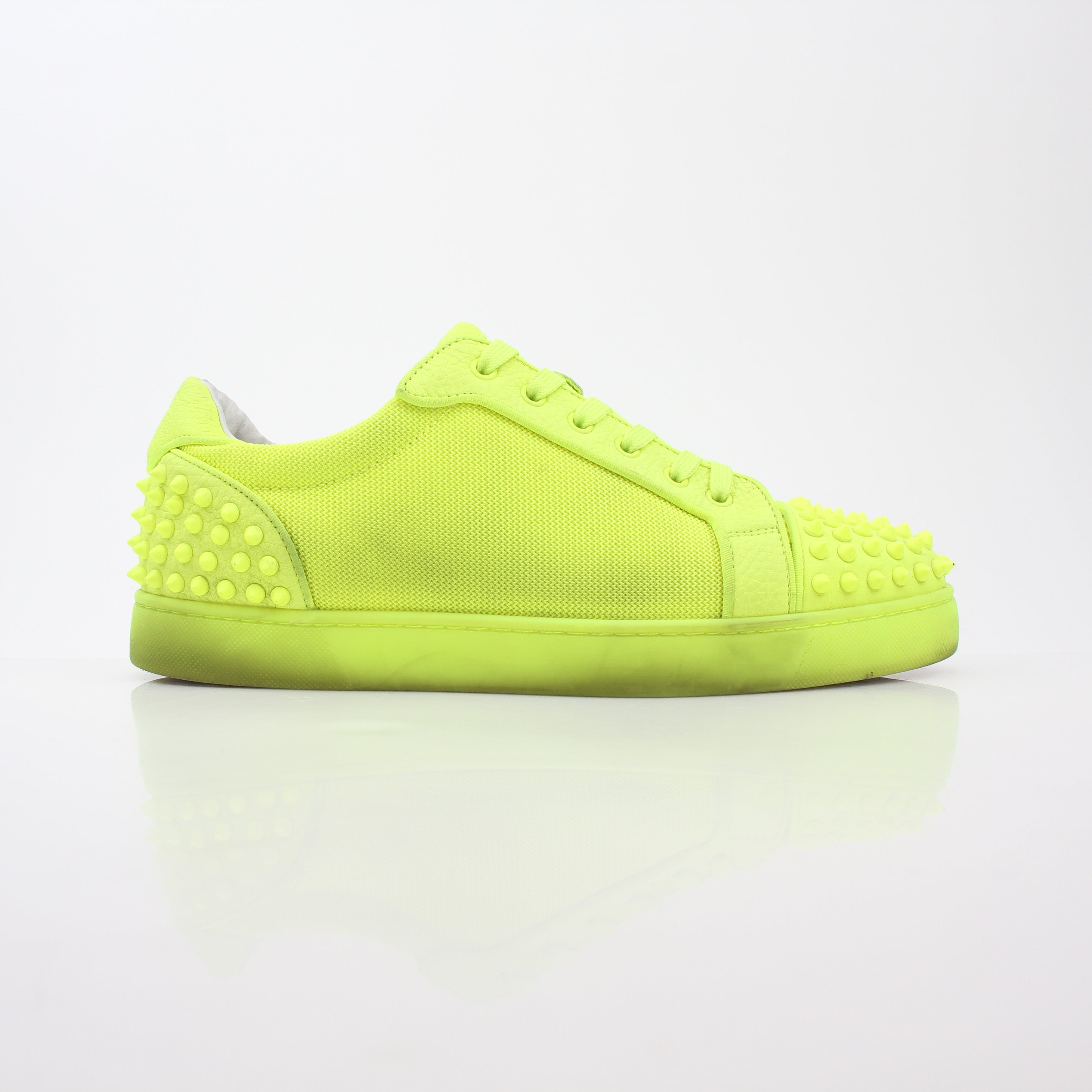 Christian Louboutin Neon Yellow Seavaste 2 Orlato sneakers with sleek design and vibrant color, displayed on a white background.