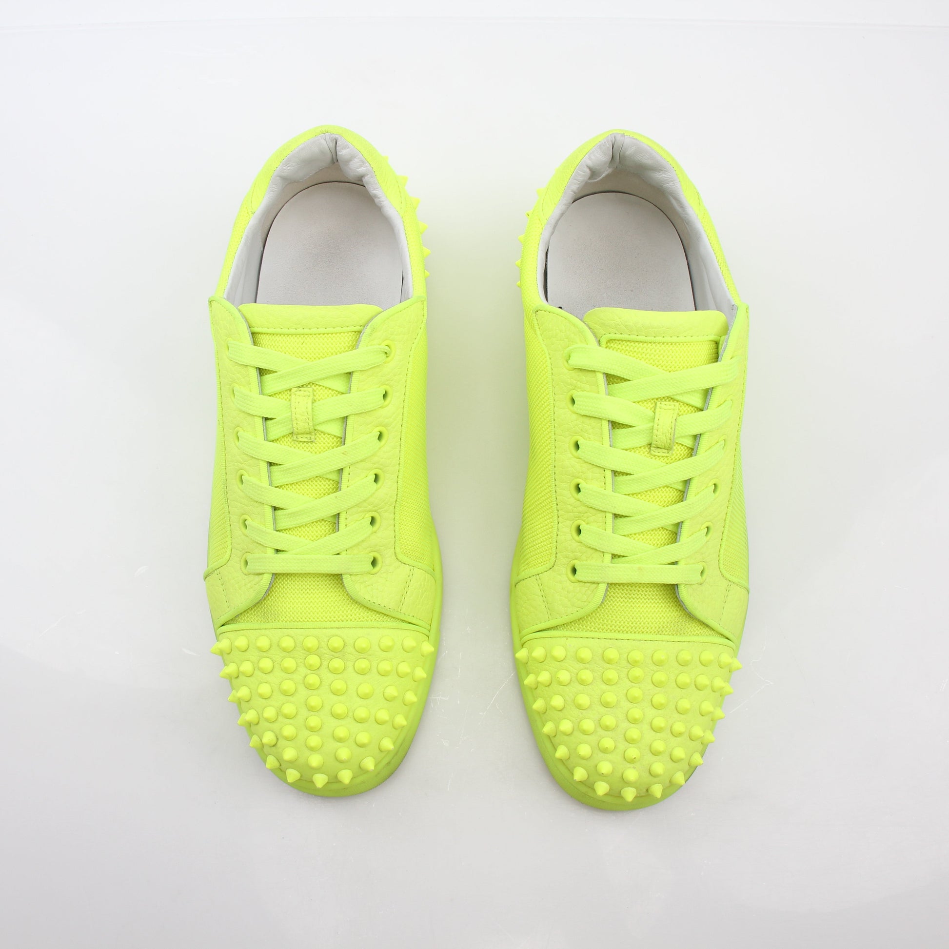 Christian Louboutin Neon Yellow Seavaste 2 Orlato sneakers with sleek design and bold color, displayed on a plain background.