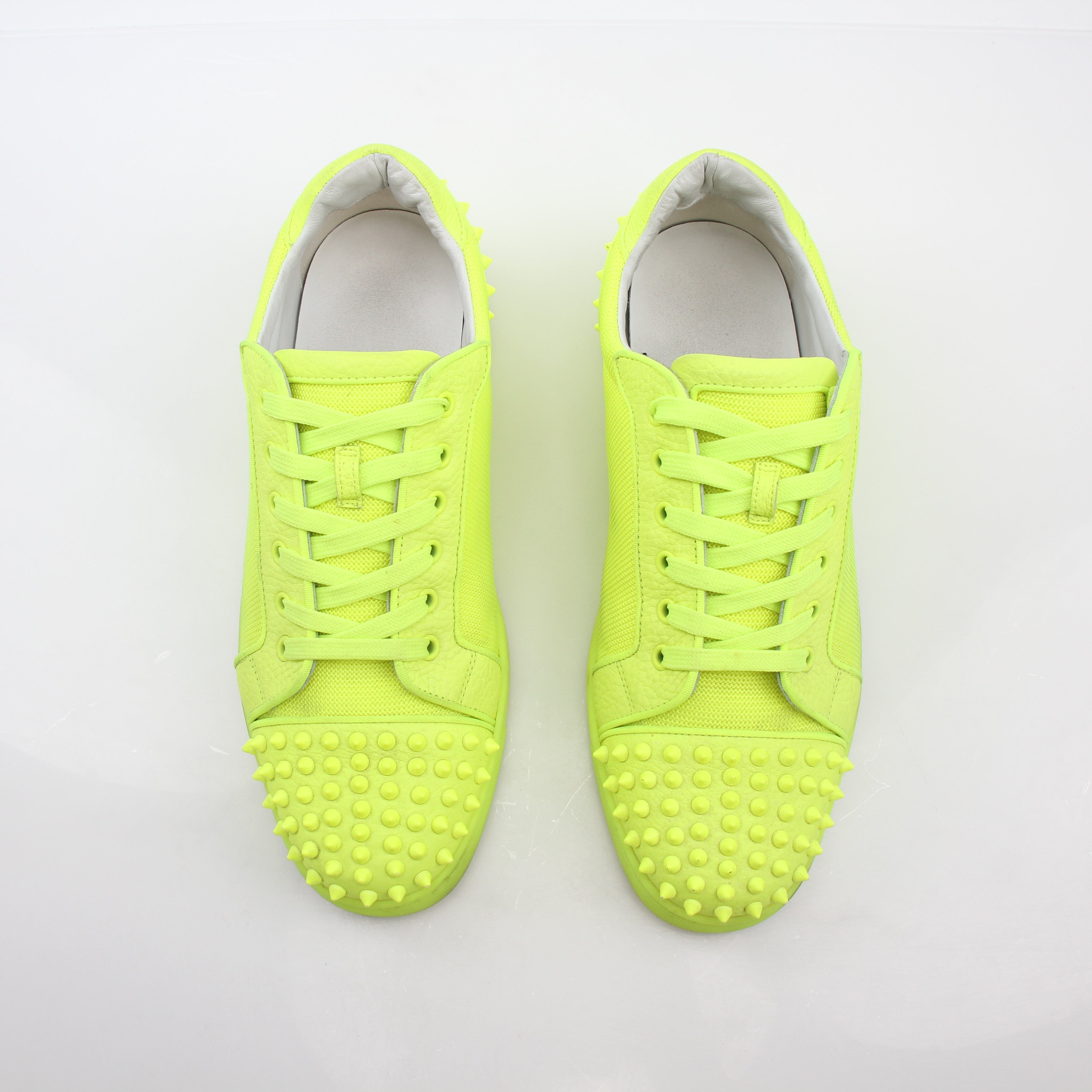 Christian Louboutin Neon Yellow Seavaste 2 Orlato sneakers with sleek design and bold color, displayed on a plain background.