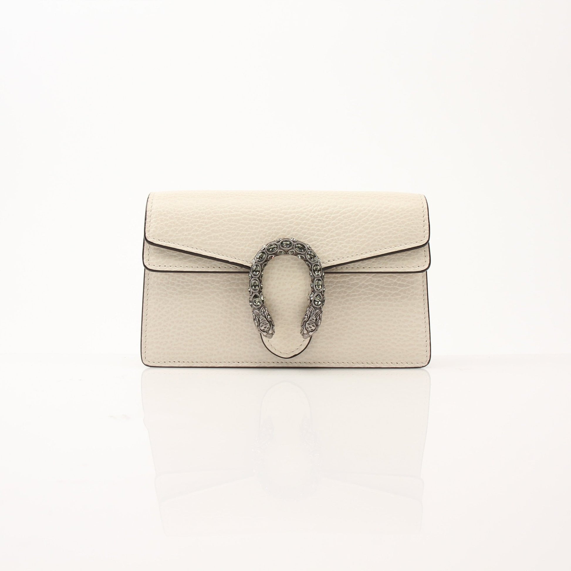Gucci Super Mini Dionysus shoulder handbag in gold and beige leather with signature tiger head clasp and chain strap.