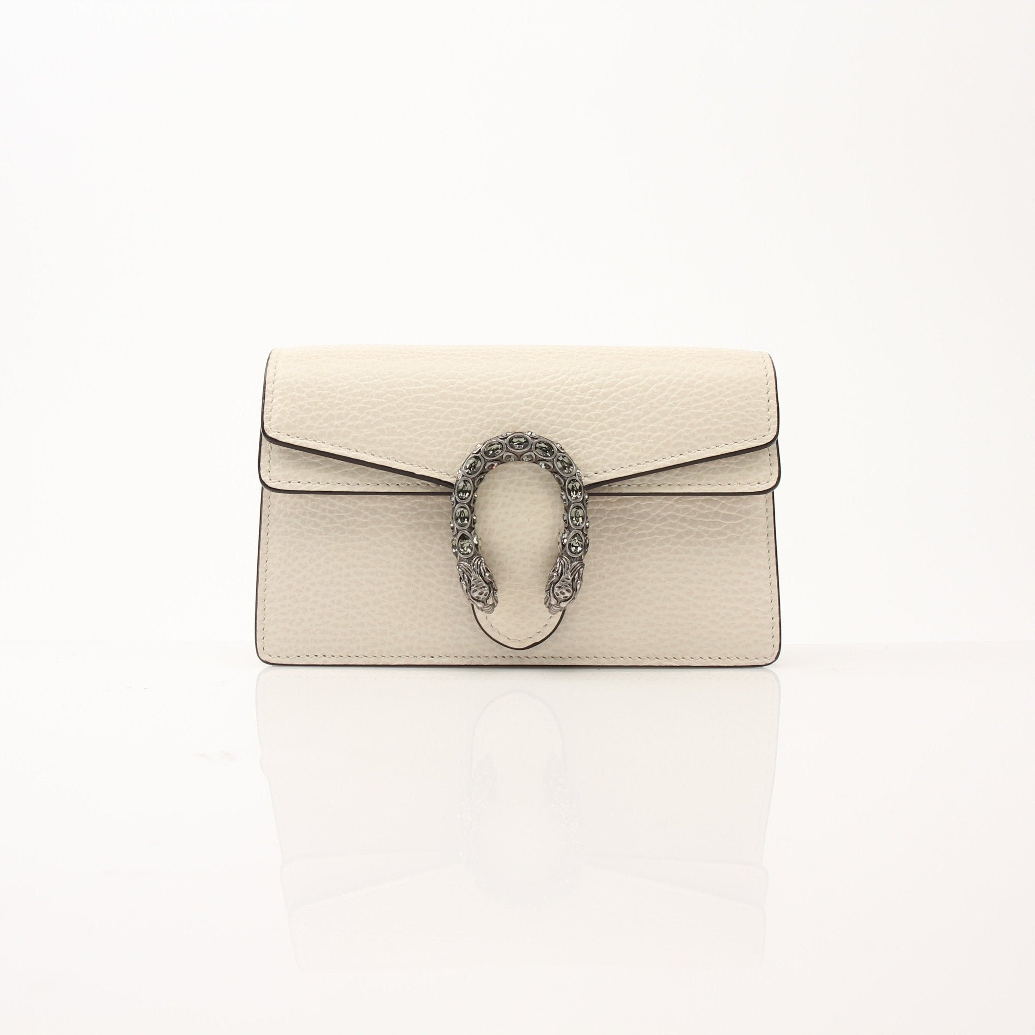 Gucci Super Mini Dionysus shoulder handbag in gold and beige leather with signature tiger head clasp and chain strap.