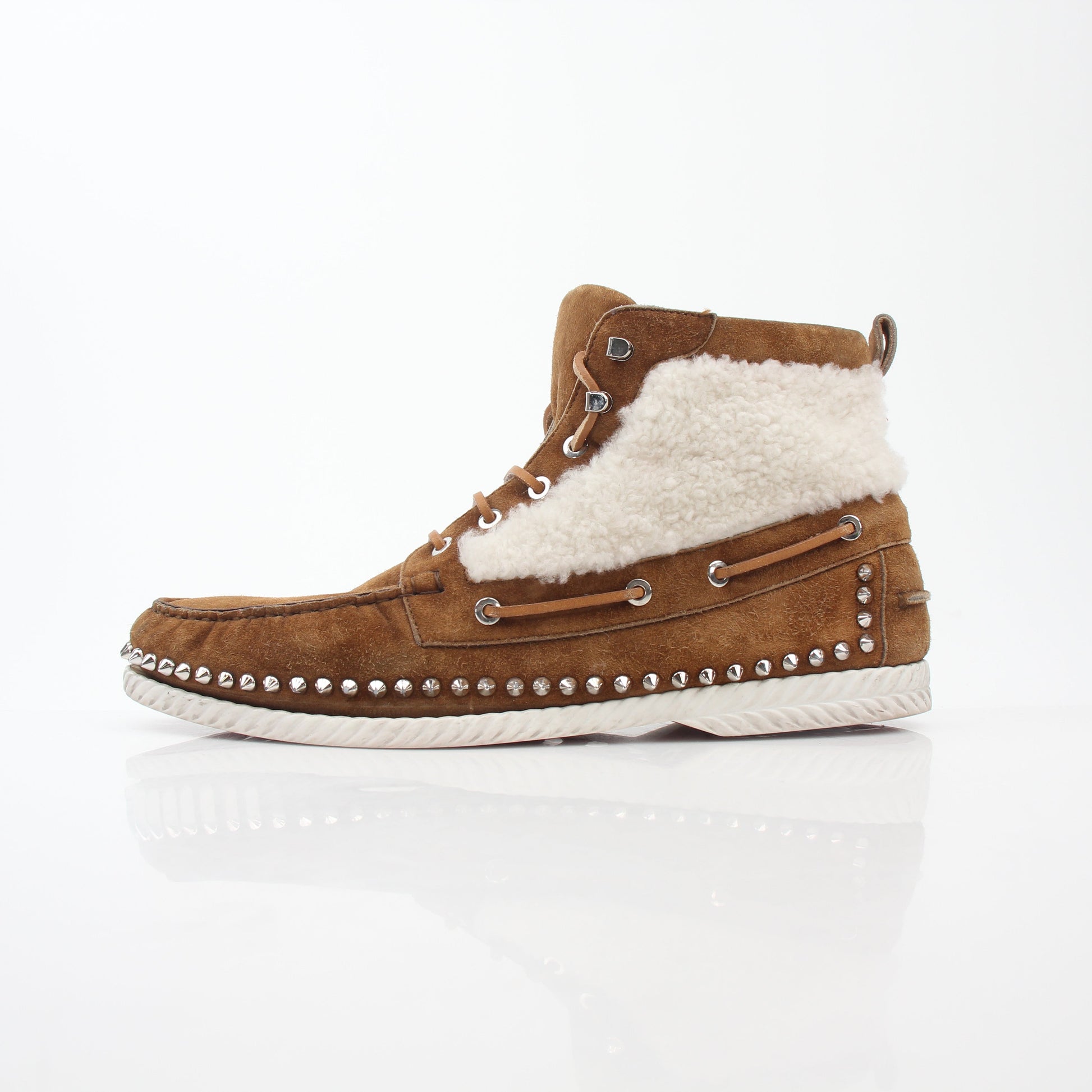 Christian Louboutin Steckel flat shearling boots with black leather and shearling lining, featuring signature red soles.