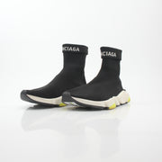 Black Balenciaga Speed 2.0 Turn Over Knit Sneakers featuring a sleek design and knit upper, worn on a casual setting.