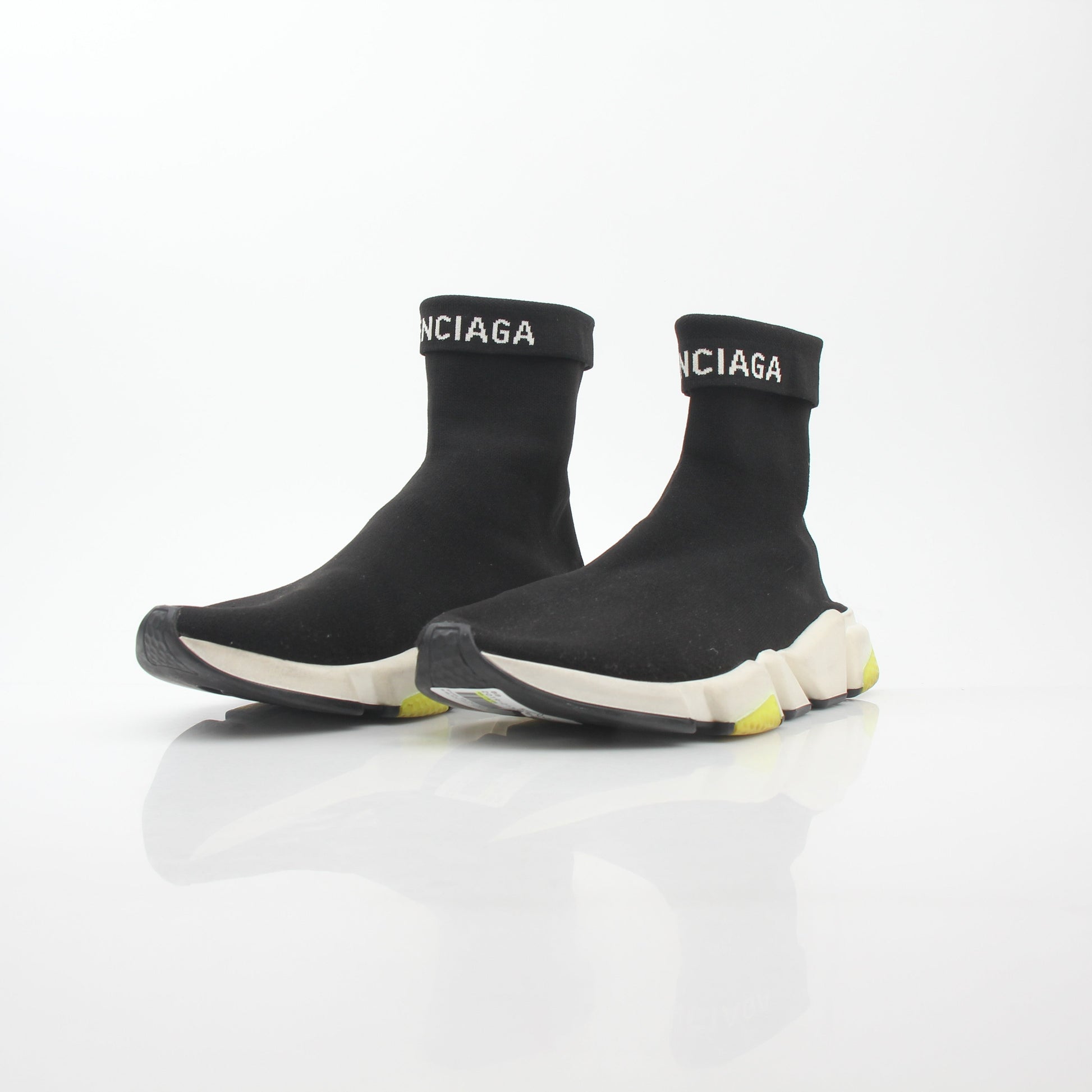 Black Balenciaga Speed 2.0 Turn Over Knit Sneakers featuring a sleek design and knit upper, worn on a casual setting.