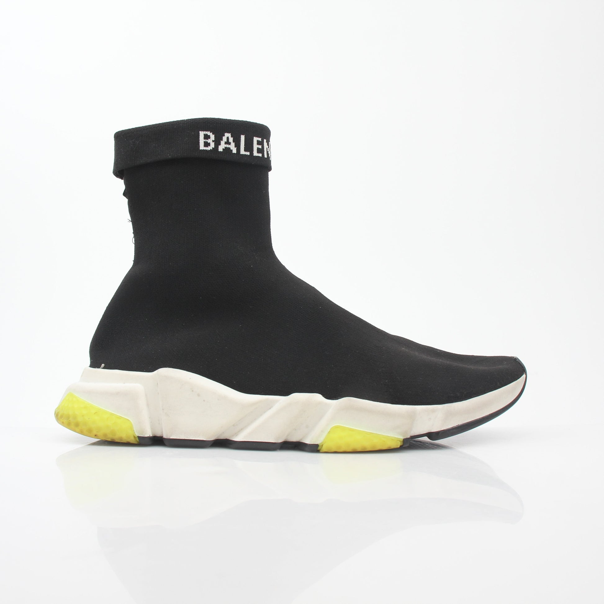 Black Balenciaga Speed 2.0 Turn Over Knit Sneakers with sleek design and white sole, displayed on a neutral background.