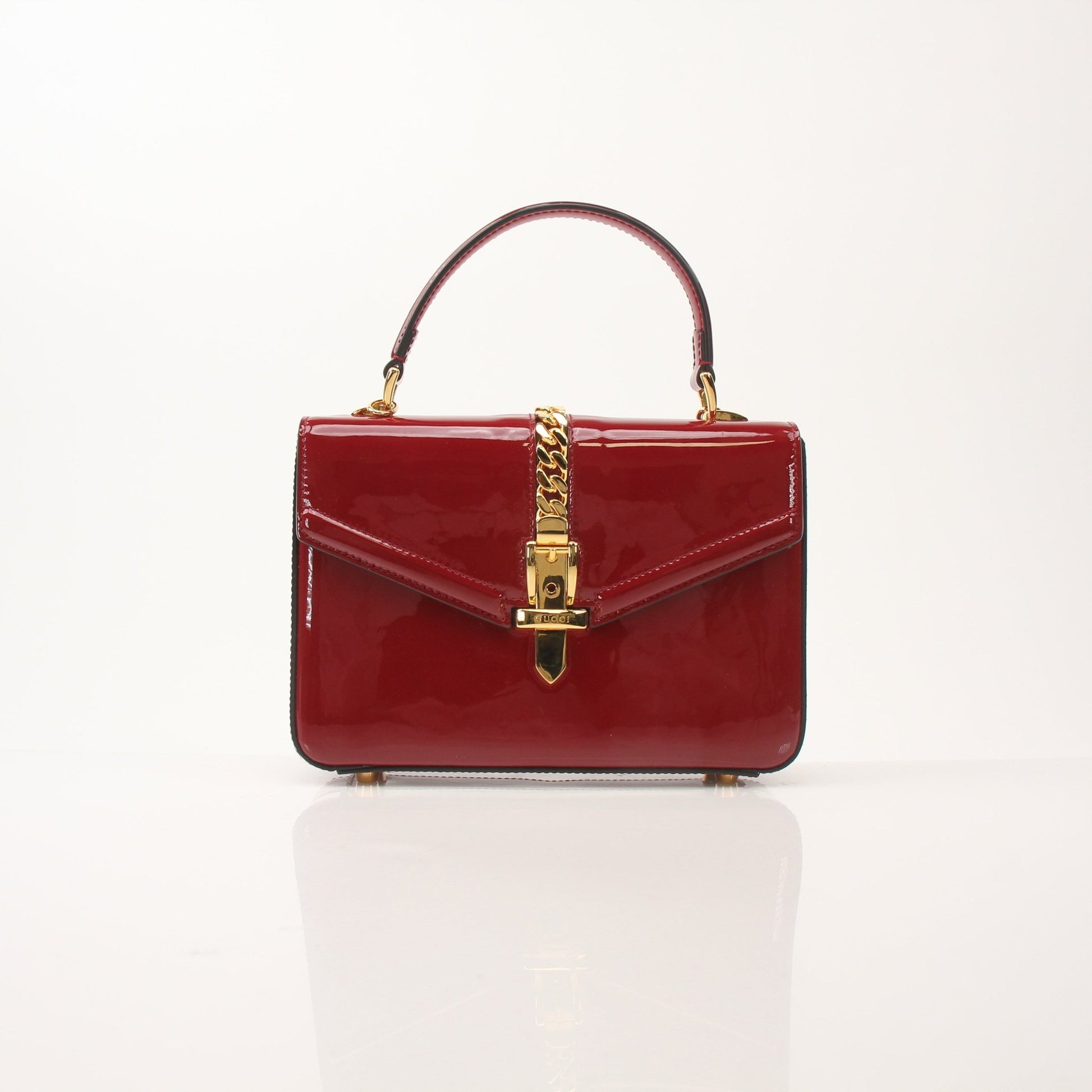Gold & Beyond Gucci Sylvie 1969 Mini Top Handle Bag, stylish handbag with gold hardware and signature design details.