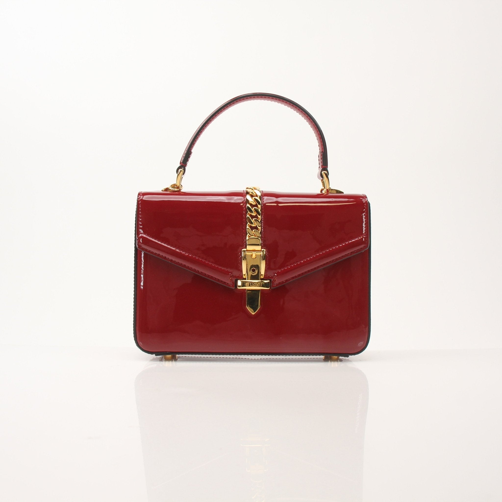 Gold & Beyond Gucci Sylvie 1969 Mini Top Handle Bag, stylish handbag with gold hardware and signature design details.