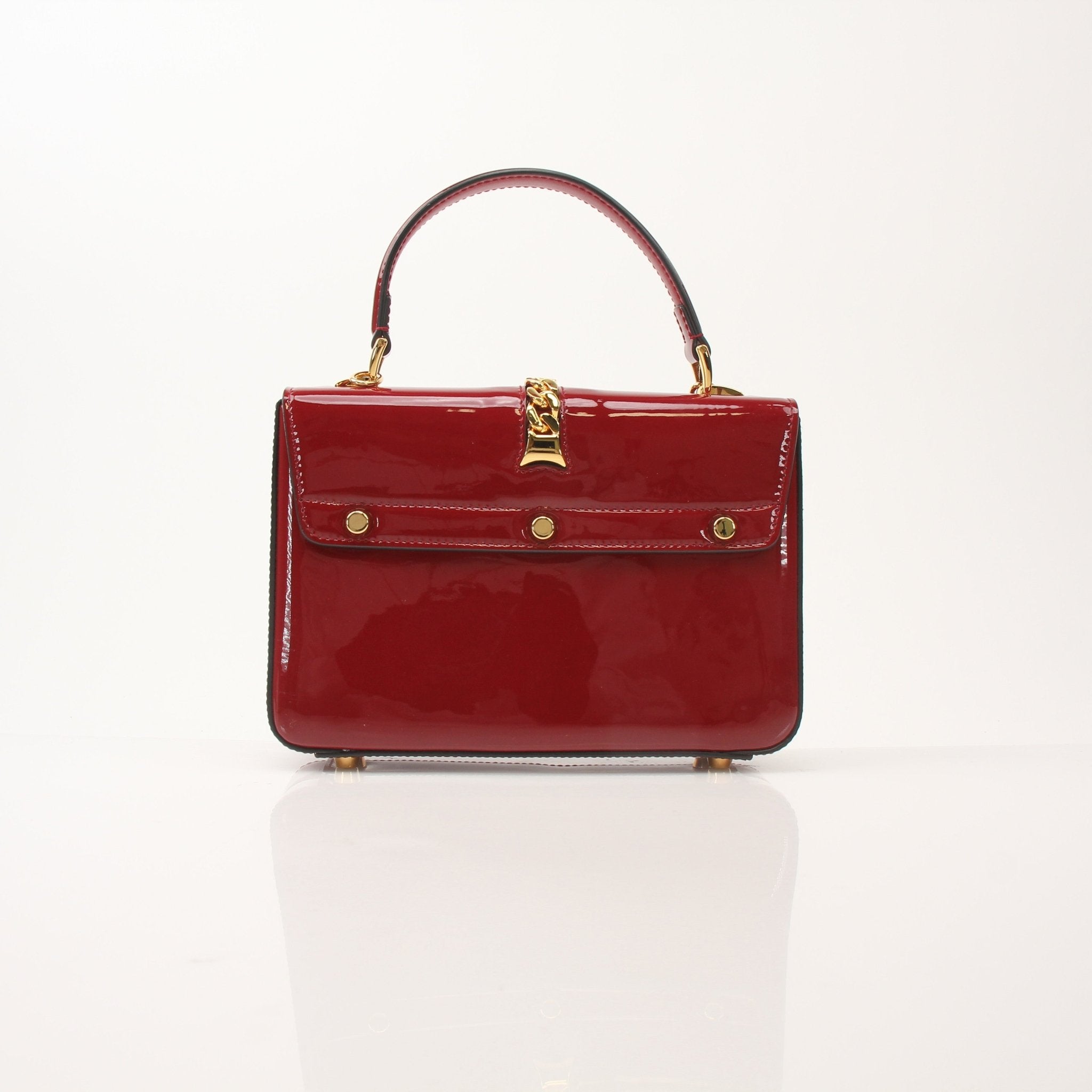 Gold & Beyond Gucci Sylvie 1969 Mini handbag with top handle, featuring signature design and luxurious leather details.