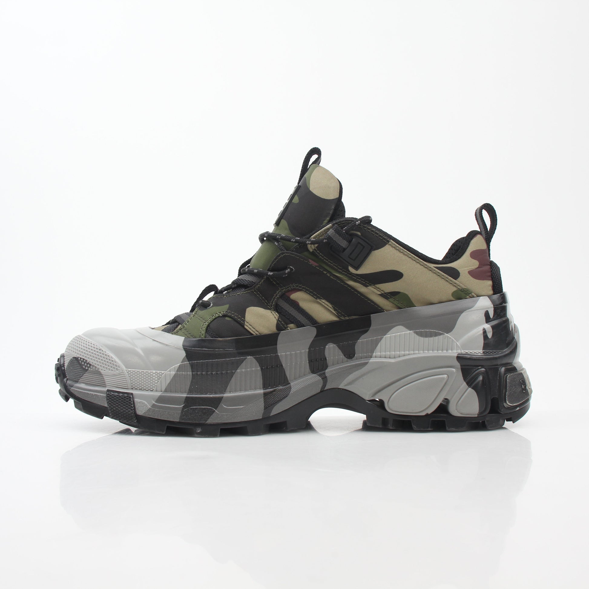Gold & Beyond Burberry Camouflage Arthur Low-Top Sneakers showing camouflage fabric, lace-up design, and low-top shoe silhouette.
