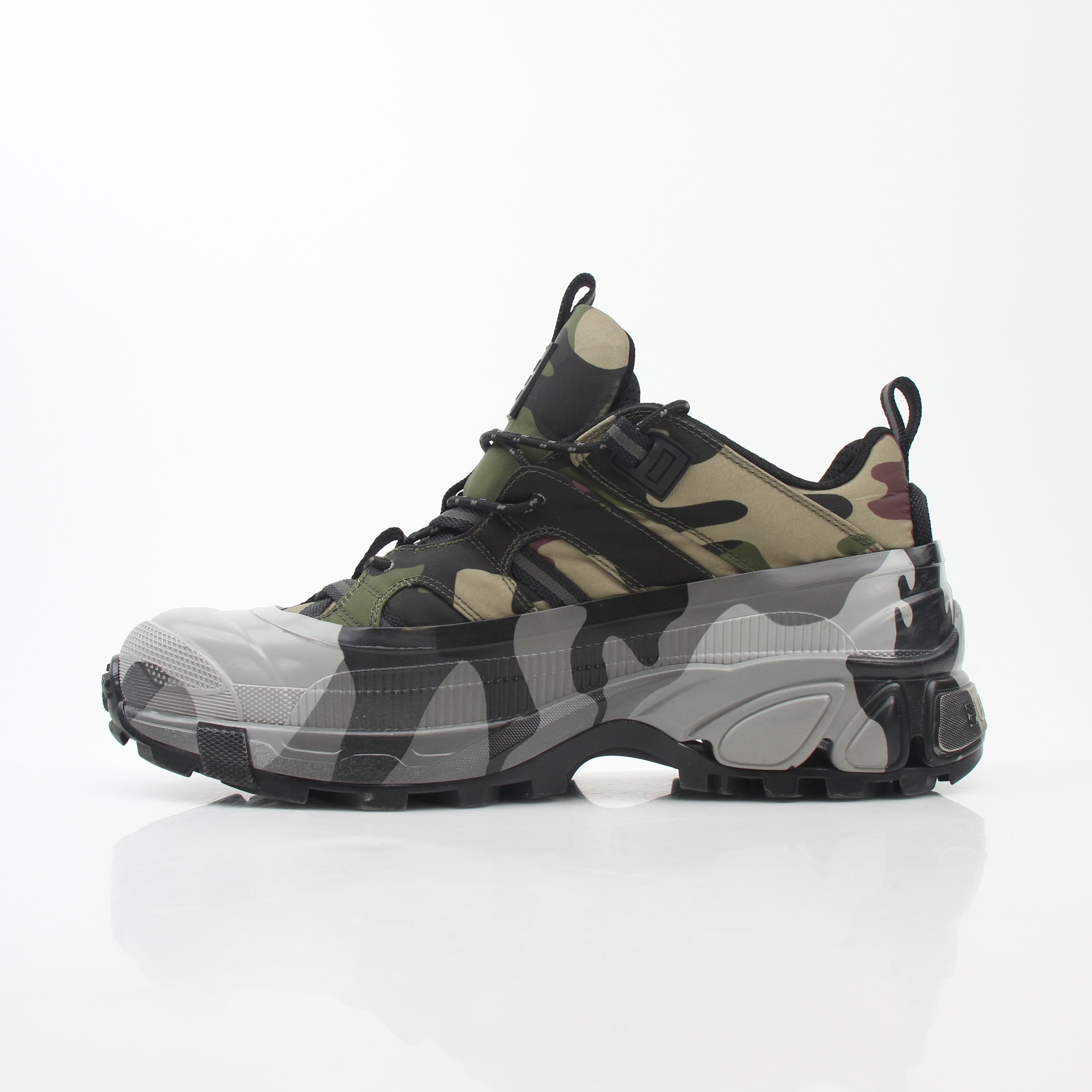 Gold & Beyond Burberry Camouflage Arthur Low-Top Sneakers showing camouflage fabric, lace-up design, and low-top shoe silhouette.
