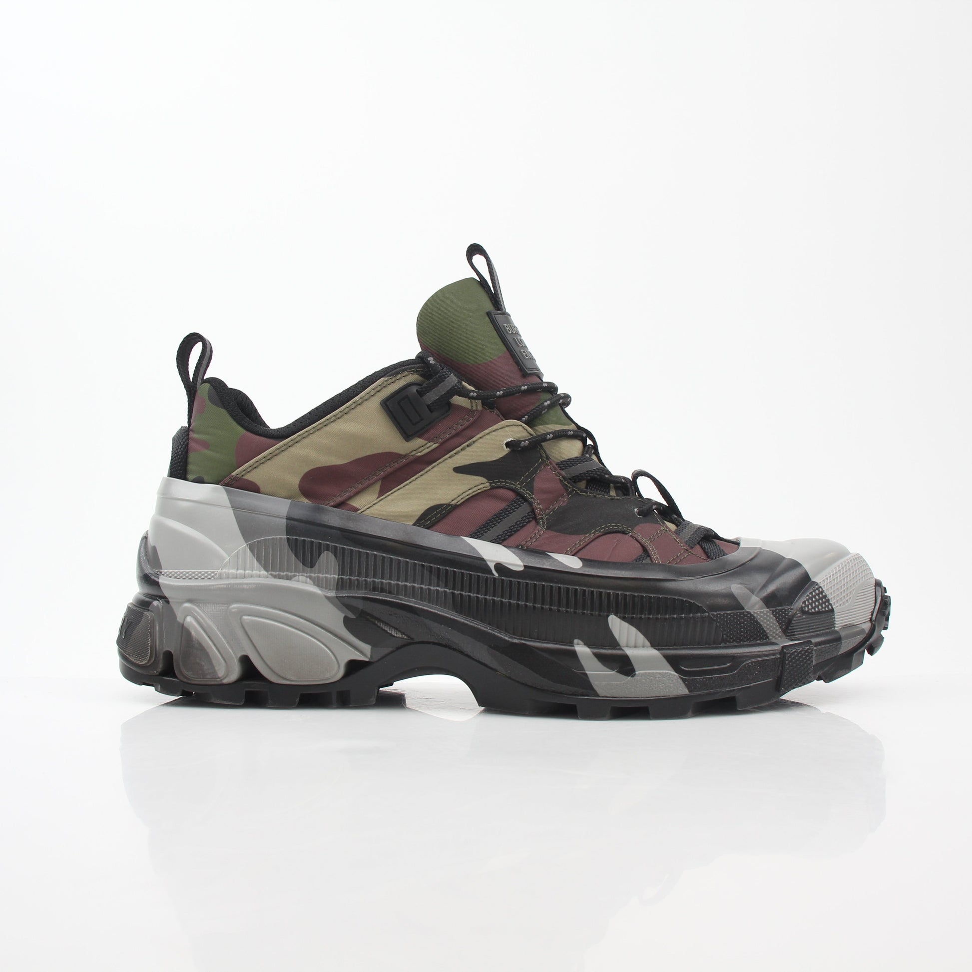 Gold & Beyond camouflage Burberry Arthur low-top sneakers with lace-up design and signature pattern on white rubber soles.