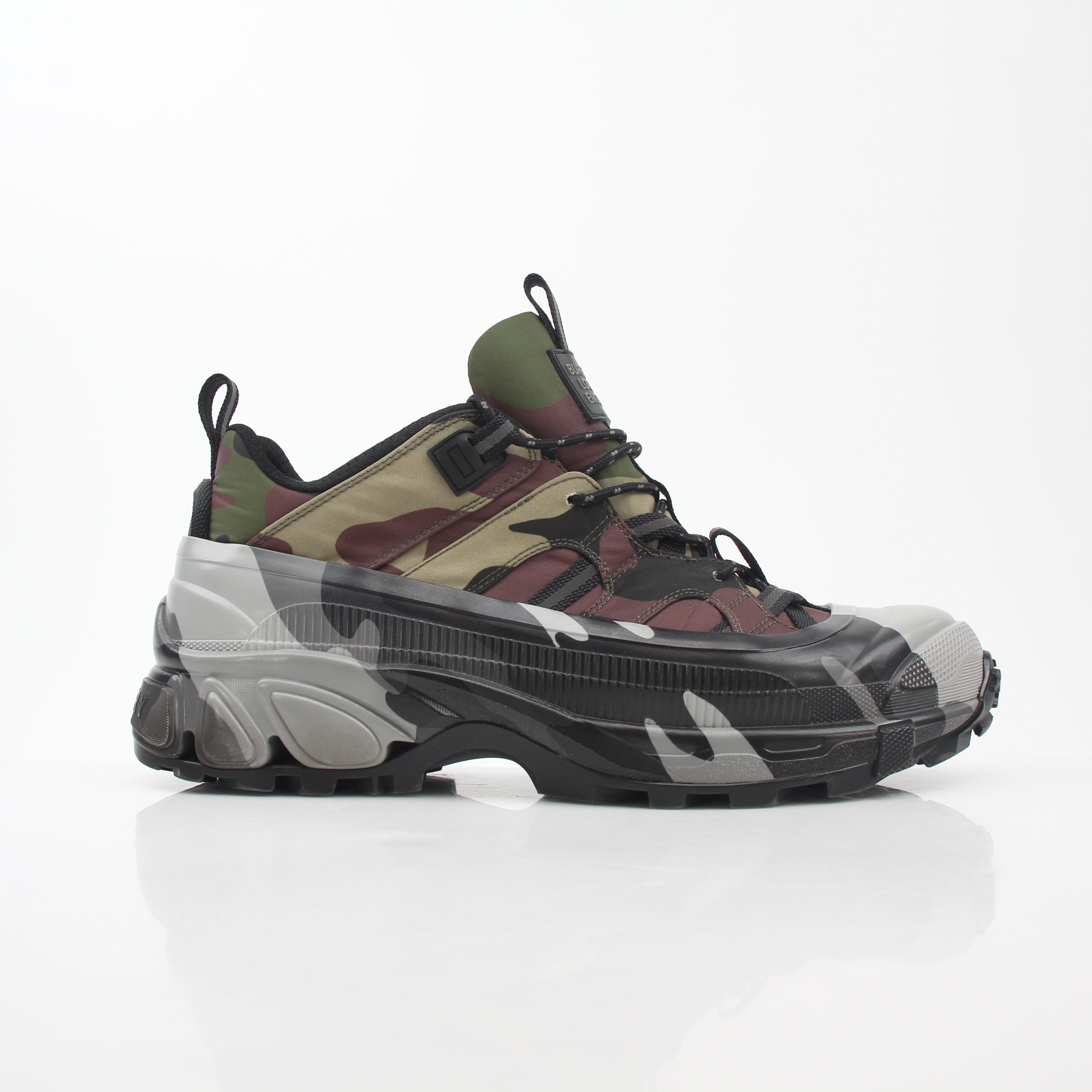 Gold & Beyond camouflage Burberry Arthur low-top sneakers with lace-up design and signature pattern on white rubber soles.