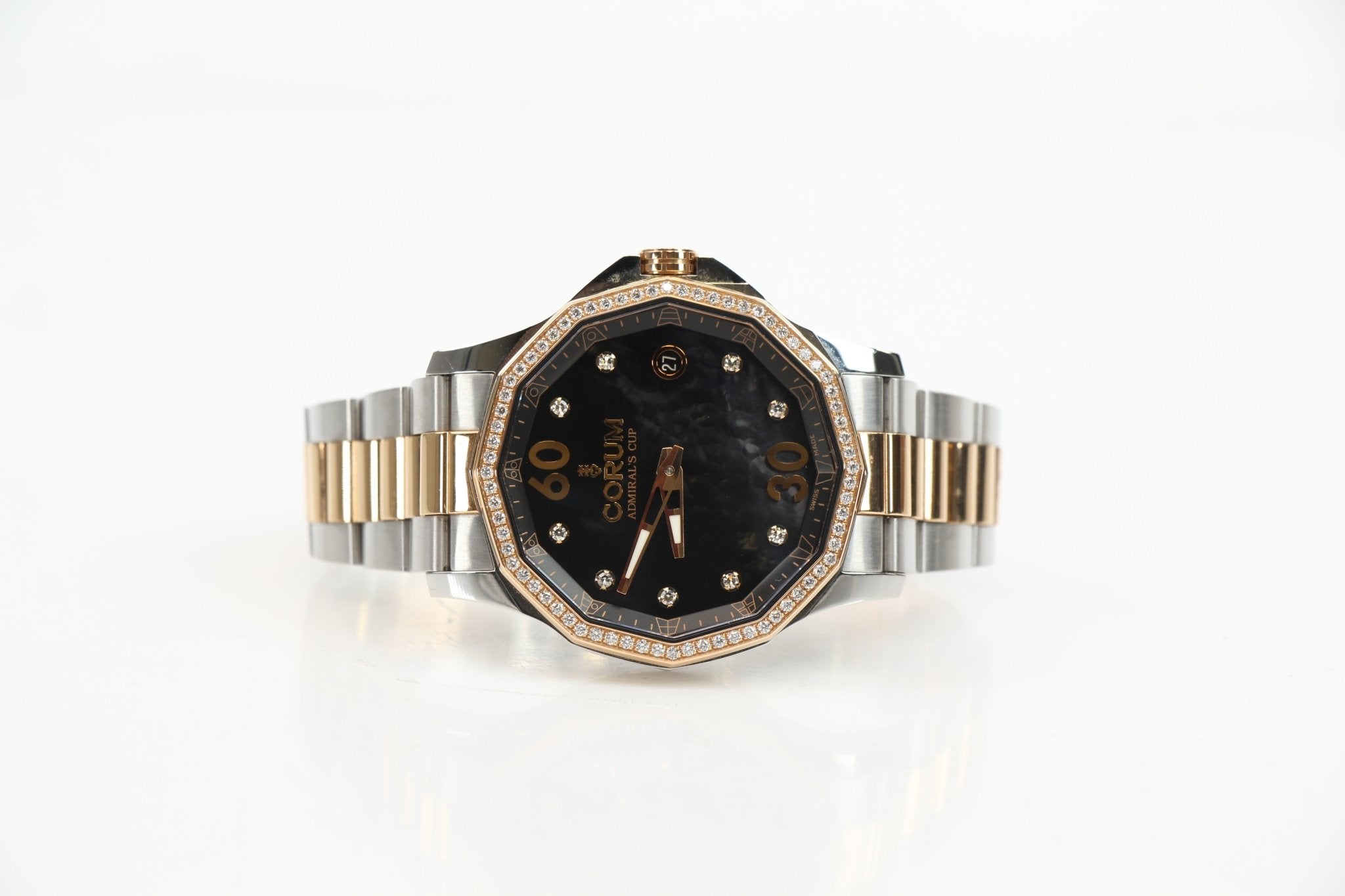 Corum Admiral’s Cup Diamond Watch with a stainless steel case, diamond accents, and a black dial, displayed on a wrist.