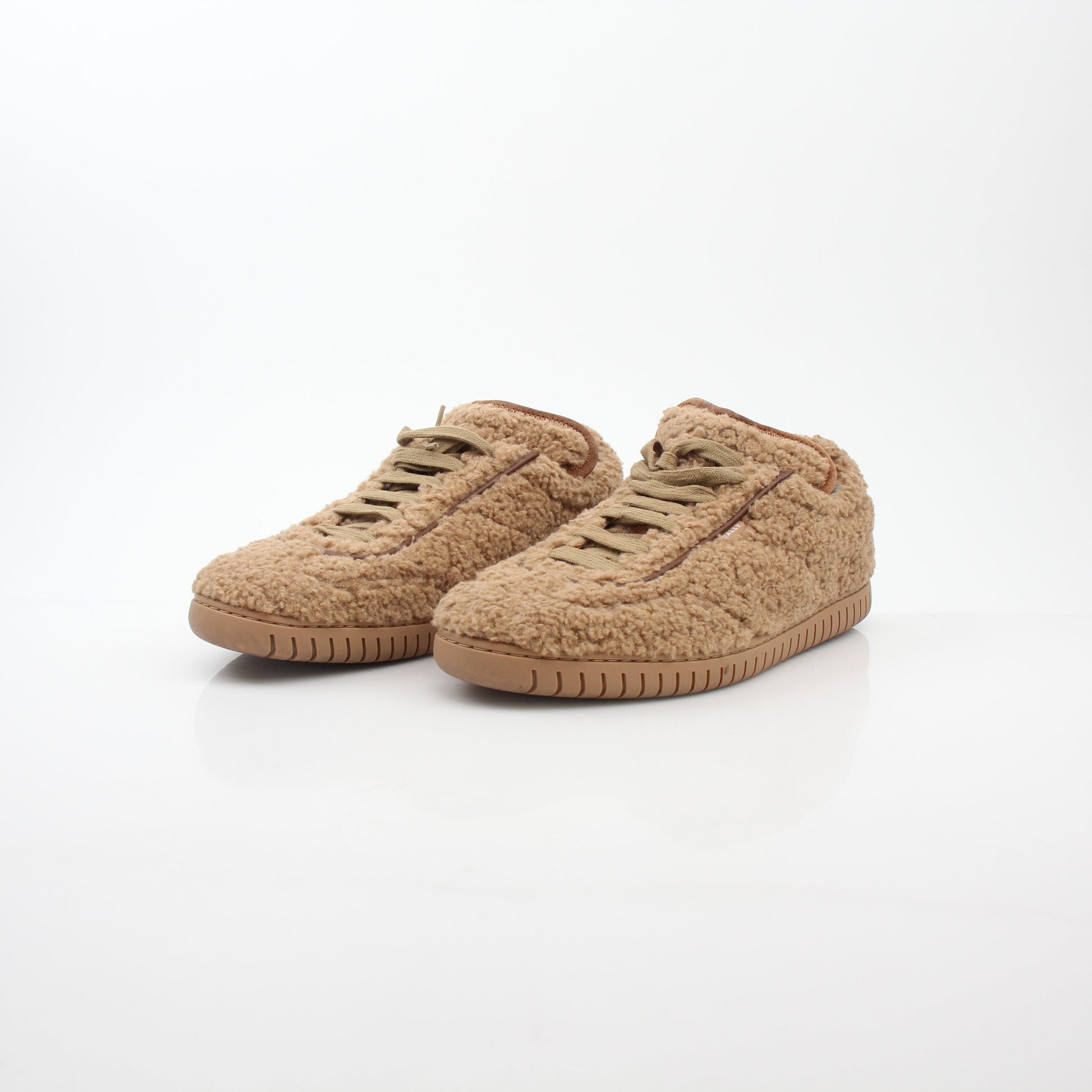 Gold & Beyond Bally beige teddy shearling low-top sneakers showing soft shearling material and casual shoe design.