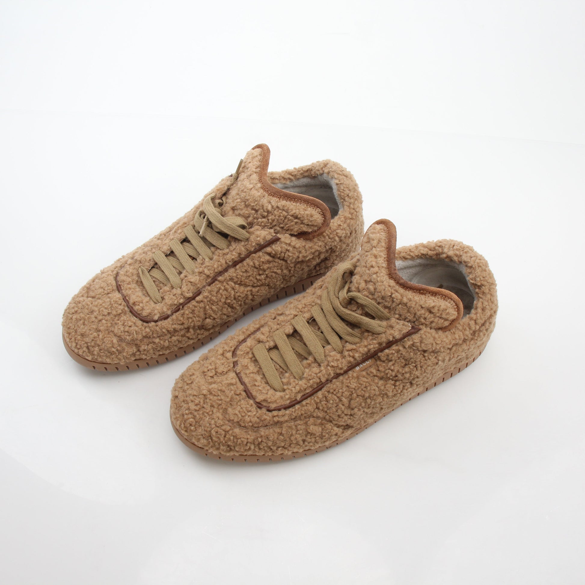 Gold & Beyond Bally beige teddy shearling low-top sneakers with soft fur lining and casual shoe style.