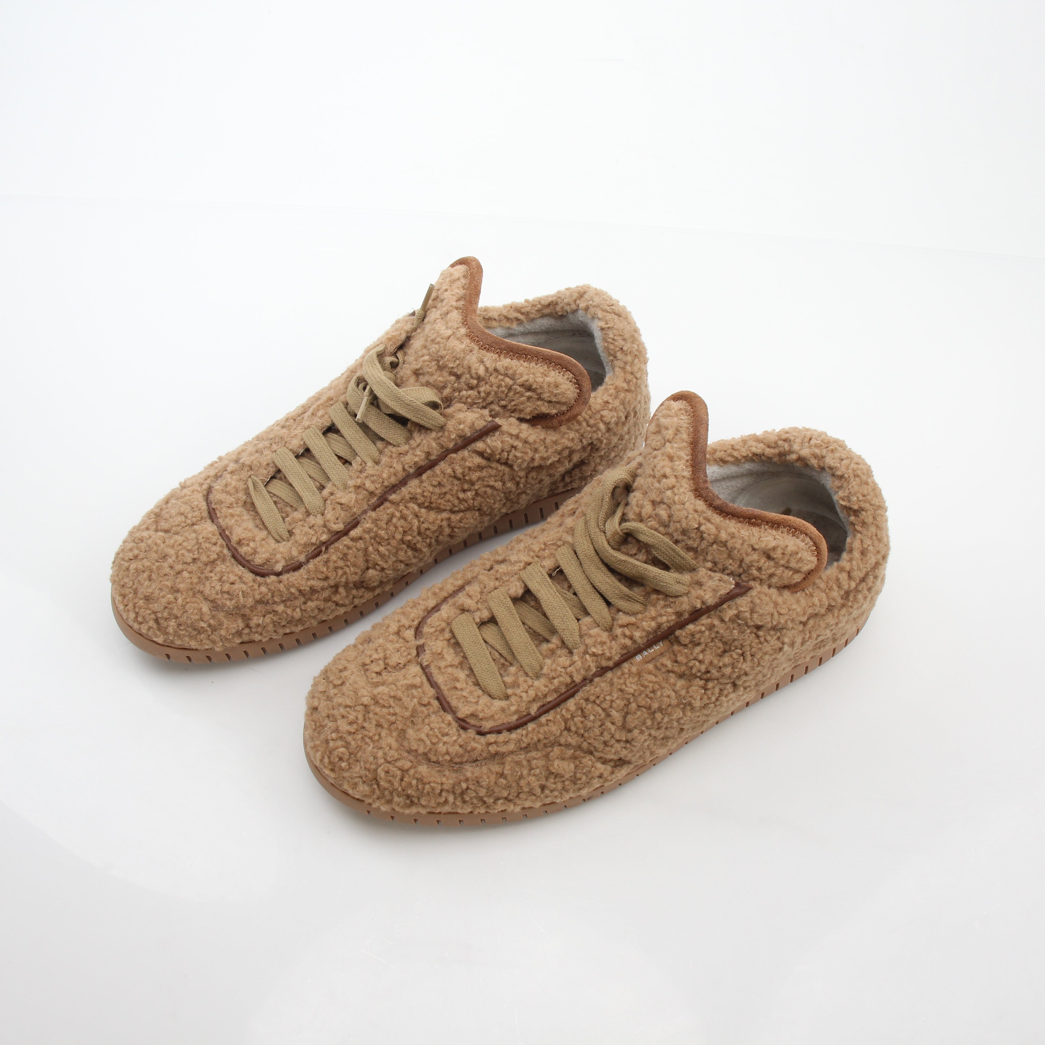 Gold & Beyond Bally beige teddy shearling low-top sneakers with soft fur lining and casual shoe style.
