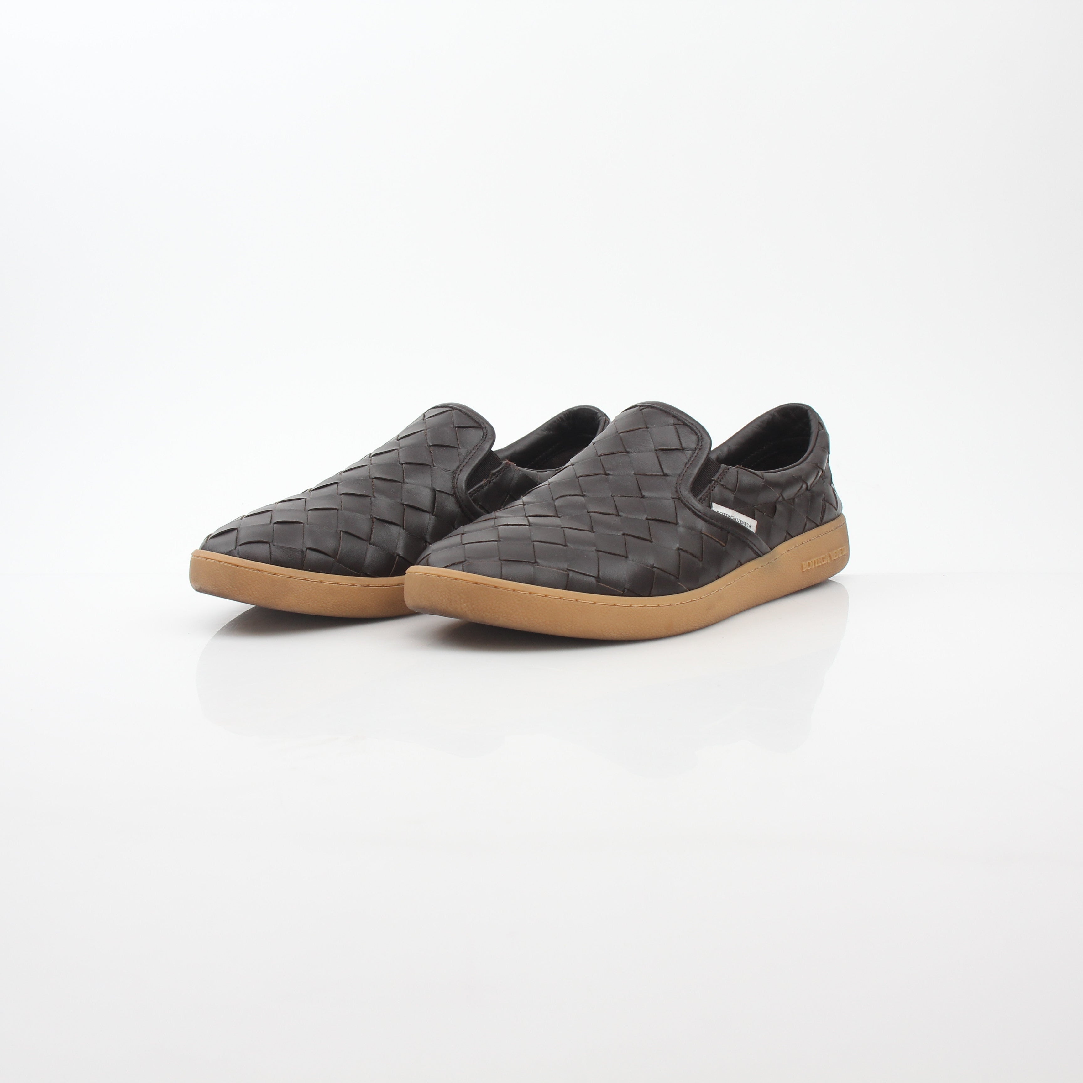 Bottega Veneta brown Sawyer Intrecciato slip-on sneakers with woven leather design, casual shoes for men from Gold & Beyond.