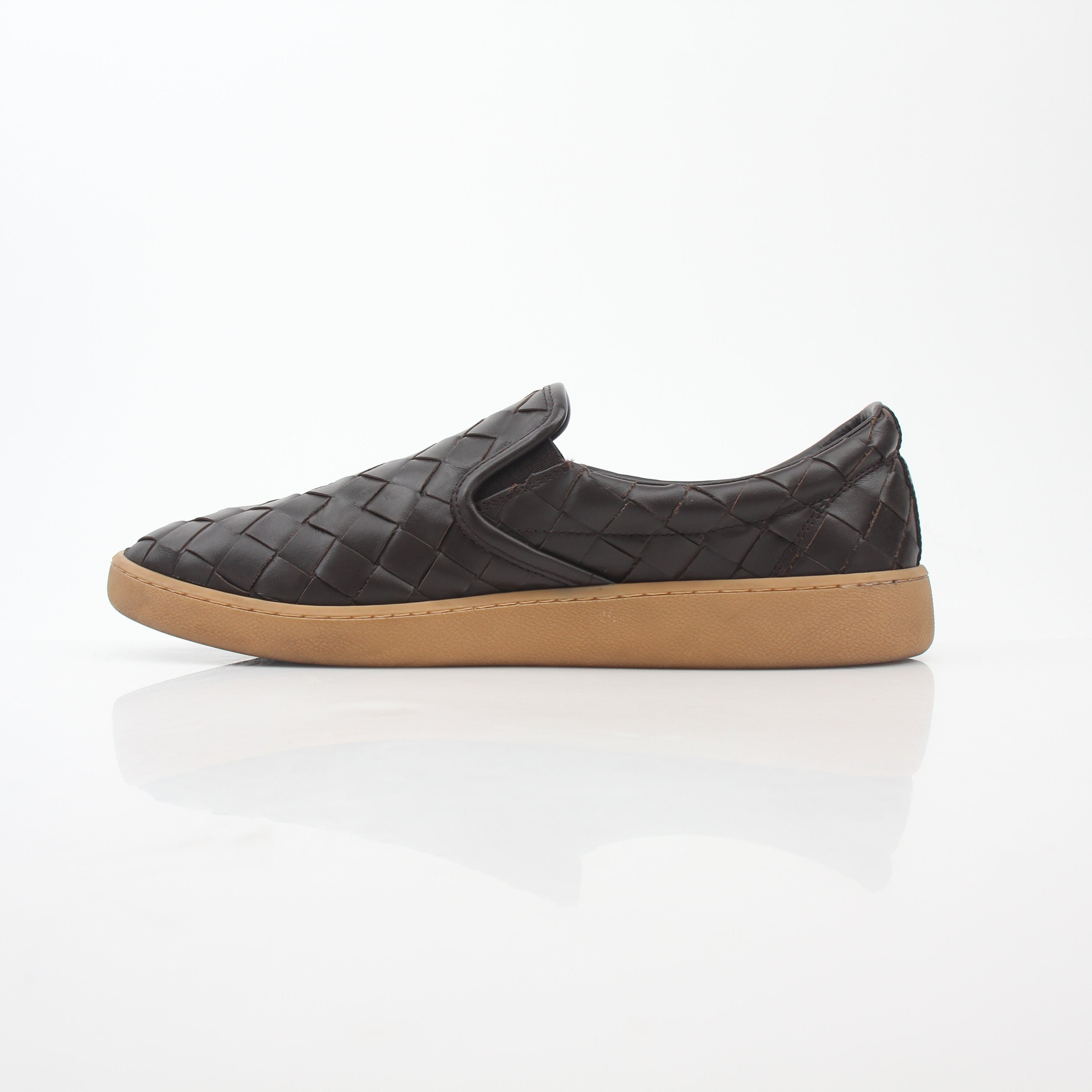 Brown Bottega Veneta Sawyer Intrecciato slip-on sneakers with woven leather design, displayed on a clean surface.