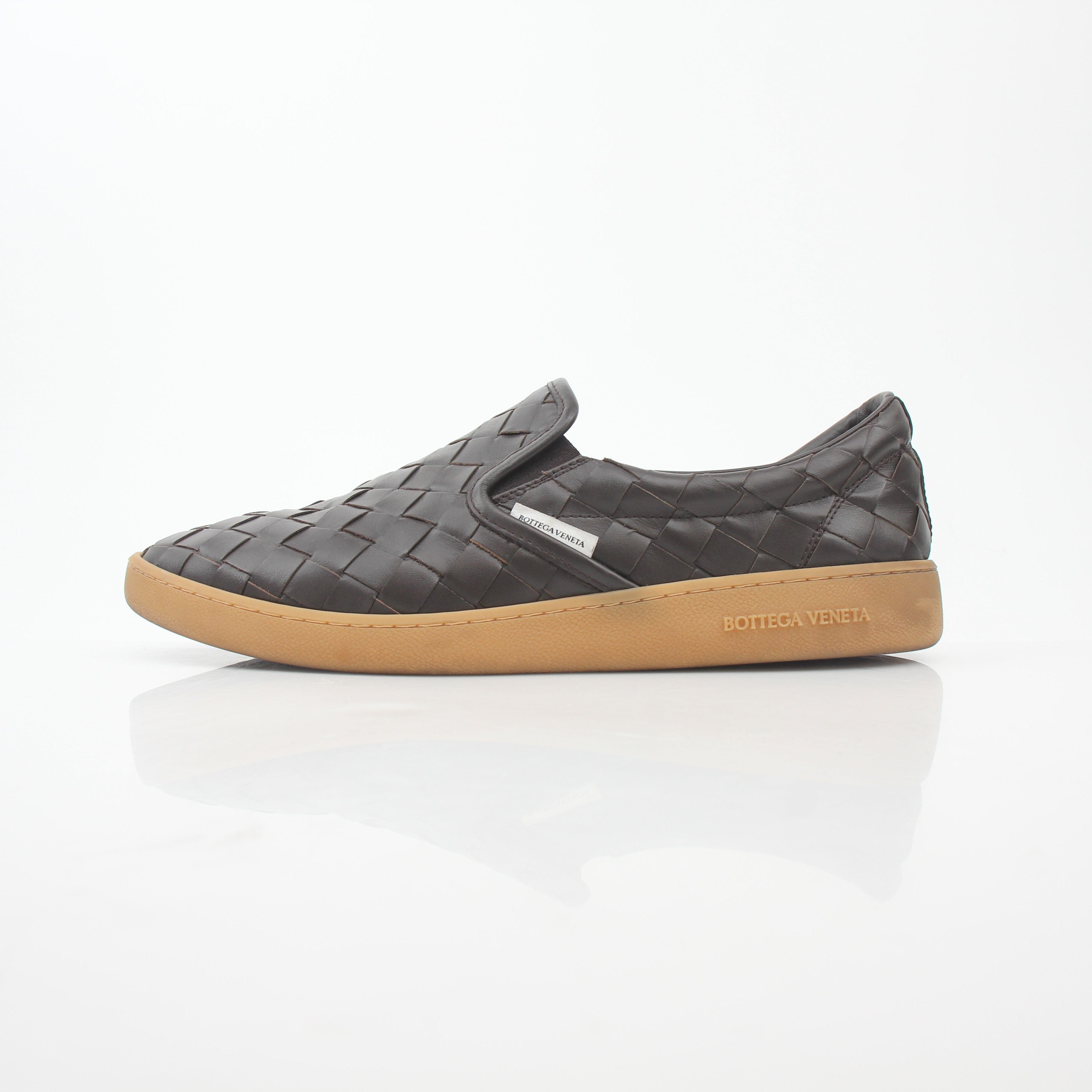 Brown Bottega Veneta Sawyer Intrecciato slip-on sneakers with woven leather design, displayed on a white background