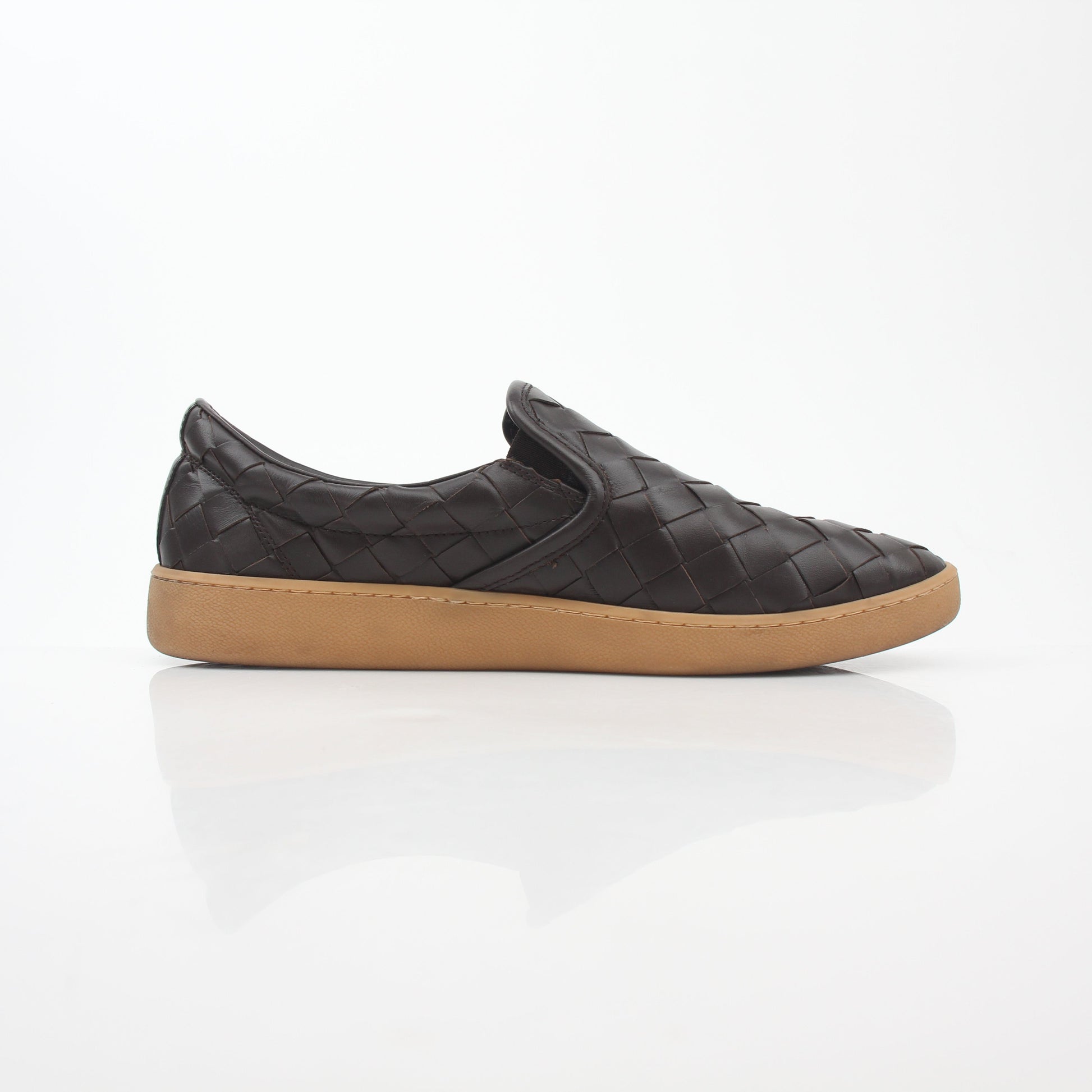 Brown Bottega Veneta Sawyer Intrecciato slip-on sneakers with woven leather design, displayed on a neutral background.