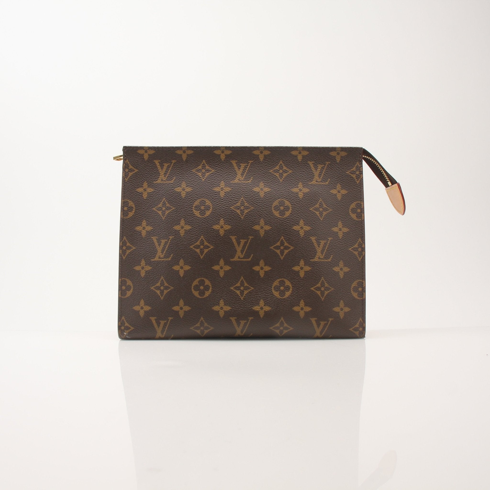 Louis Vuitton Monogram Toiletry Pouch GM vanity case with gold-tone zipper and leather trim, displayed on a white background.