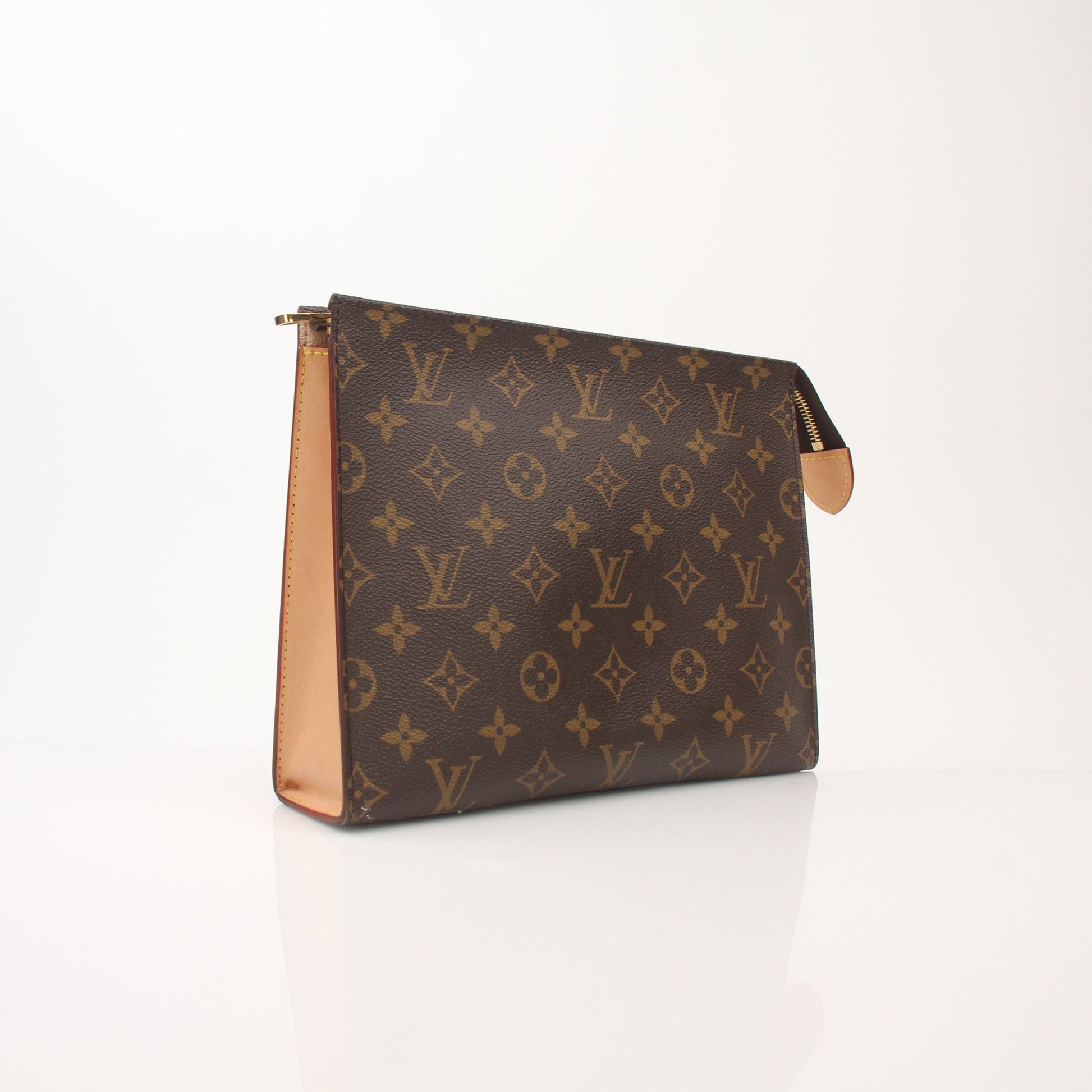 Louis Vuitton Monogram Toiletry Pouch GM vanity case with gold accents, featuring the signature monogram canvas and spacious interior.