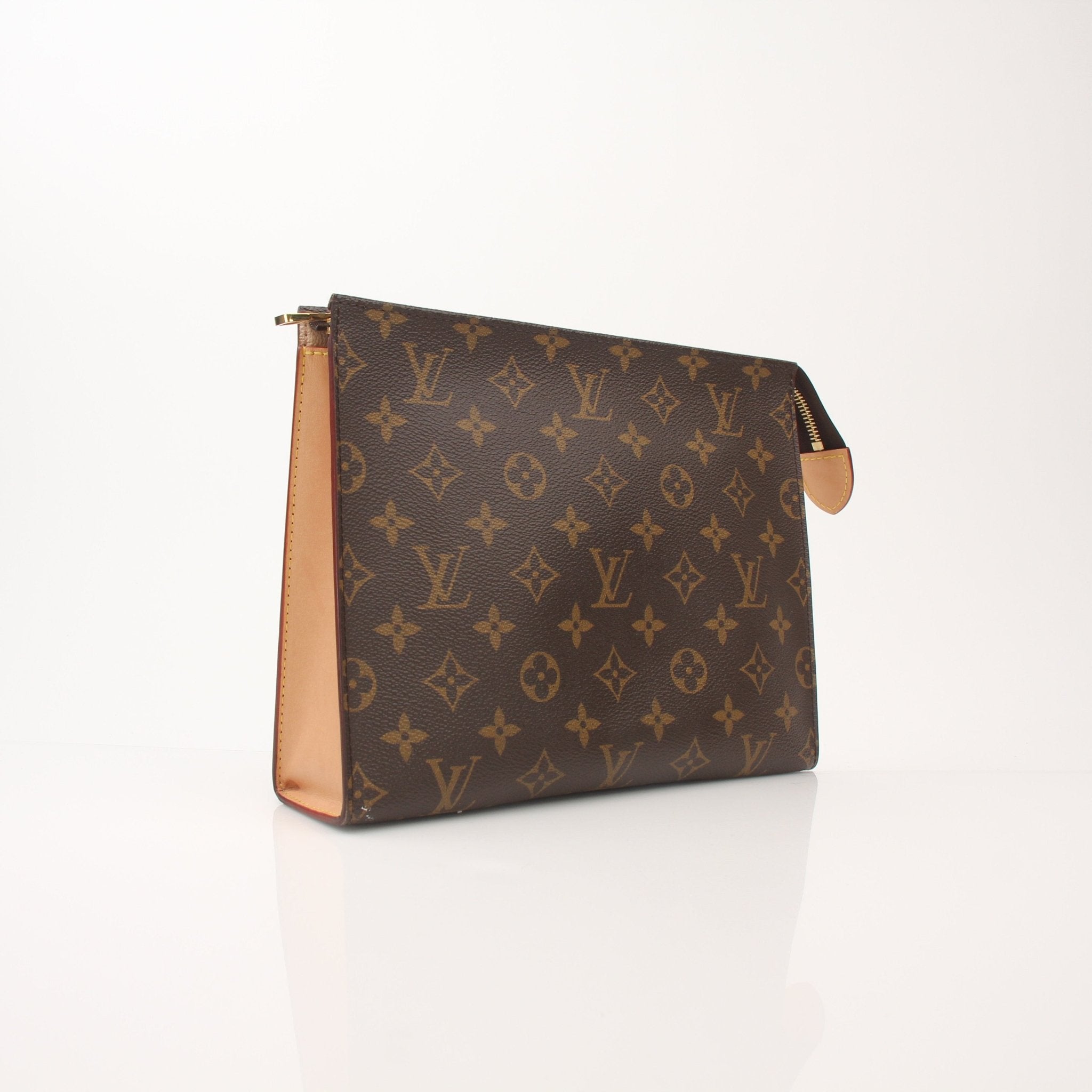 Louis Vuitton Monogram Toiletry Pouch GM vanity case with gold accents, featuring the signature monogram canvas and spacious interior.