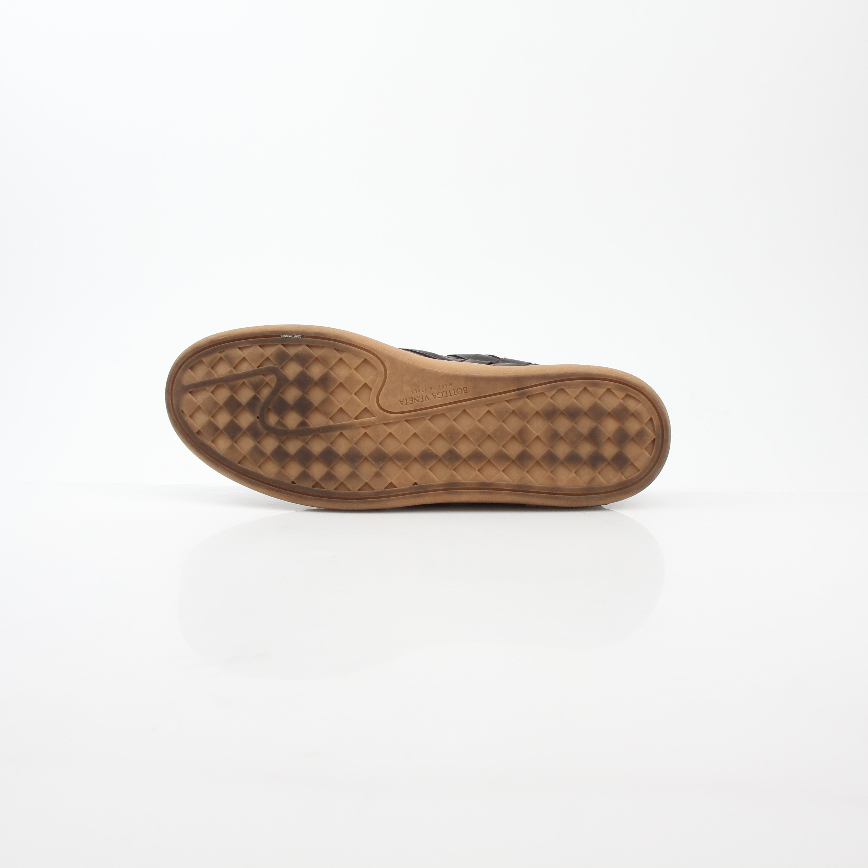 Brown Bottega Veneta Sawyer Intrecciato slip-on sneakers with woven leather design, pictured on a neutral background