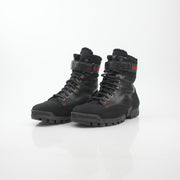 Gucci black Web accent combat boots with rugged sole and lace-up design, featuring signature branding and stylish detailing.
