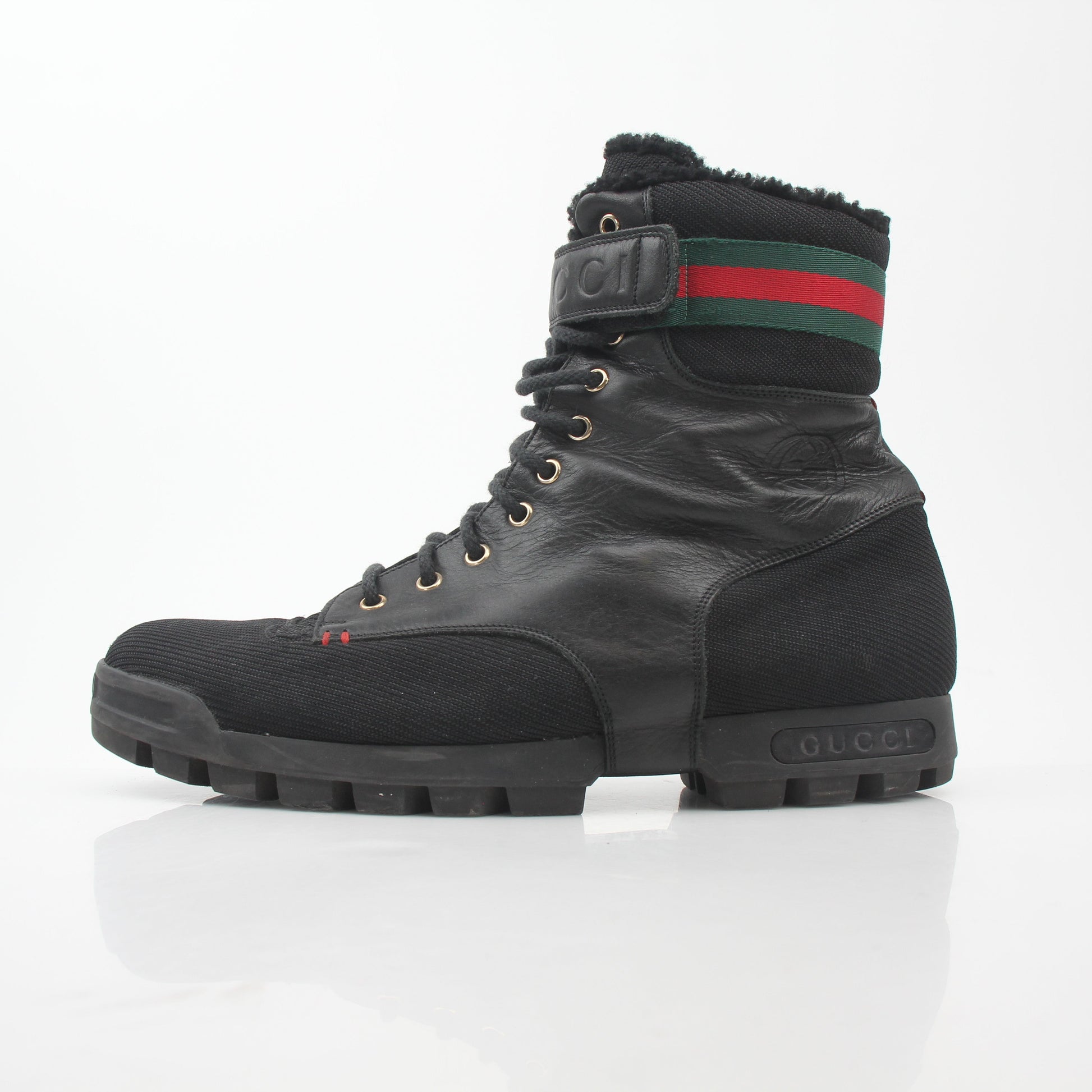 Gucci black Web accent combat boots, stylish lace-up shoes with rugged soles and signature design details.