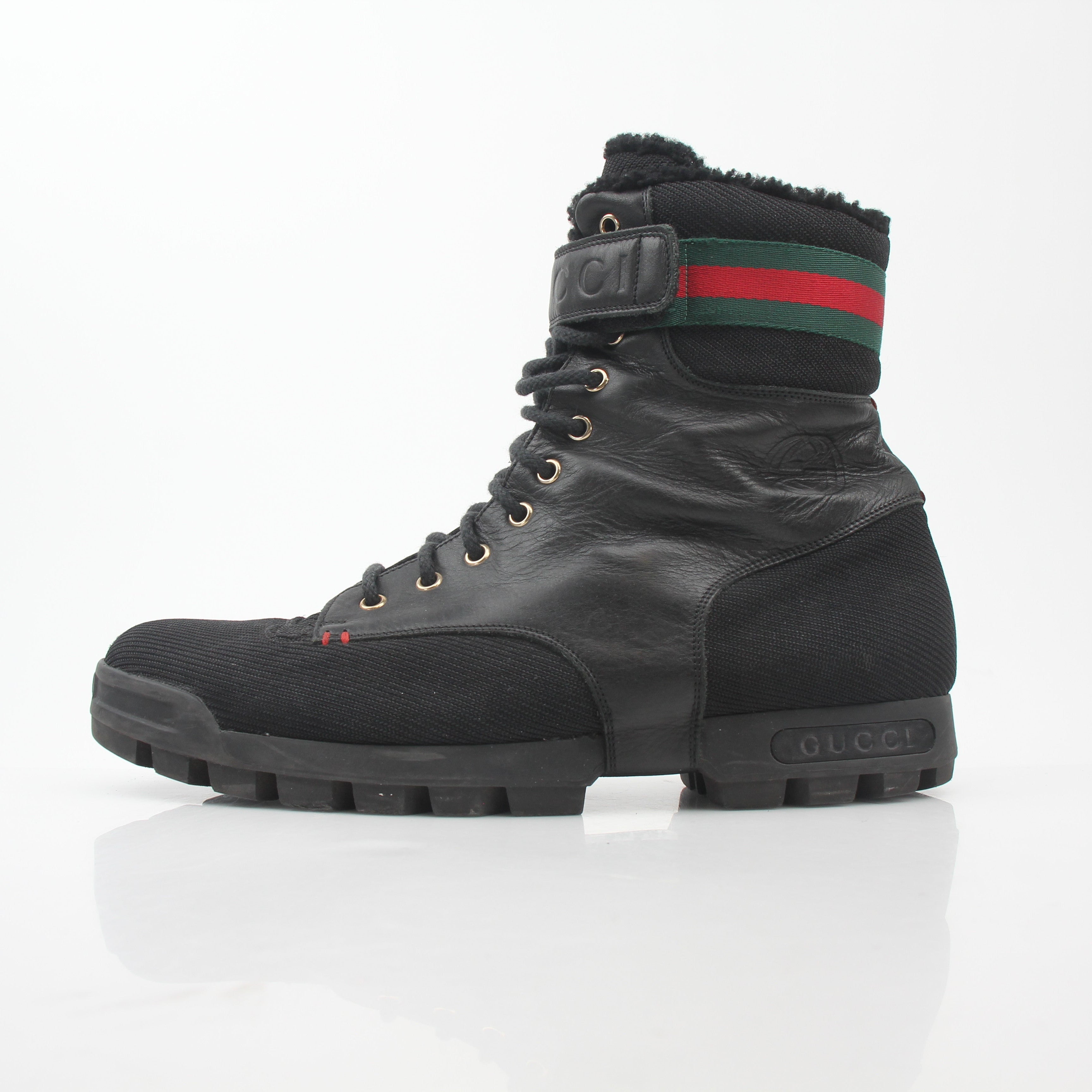 Gucci black Web accent combat boots, stylish lace-up shoes with rugged soles and signature design details.