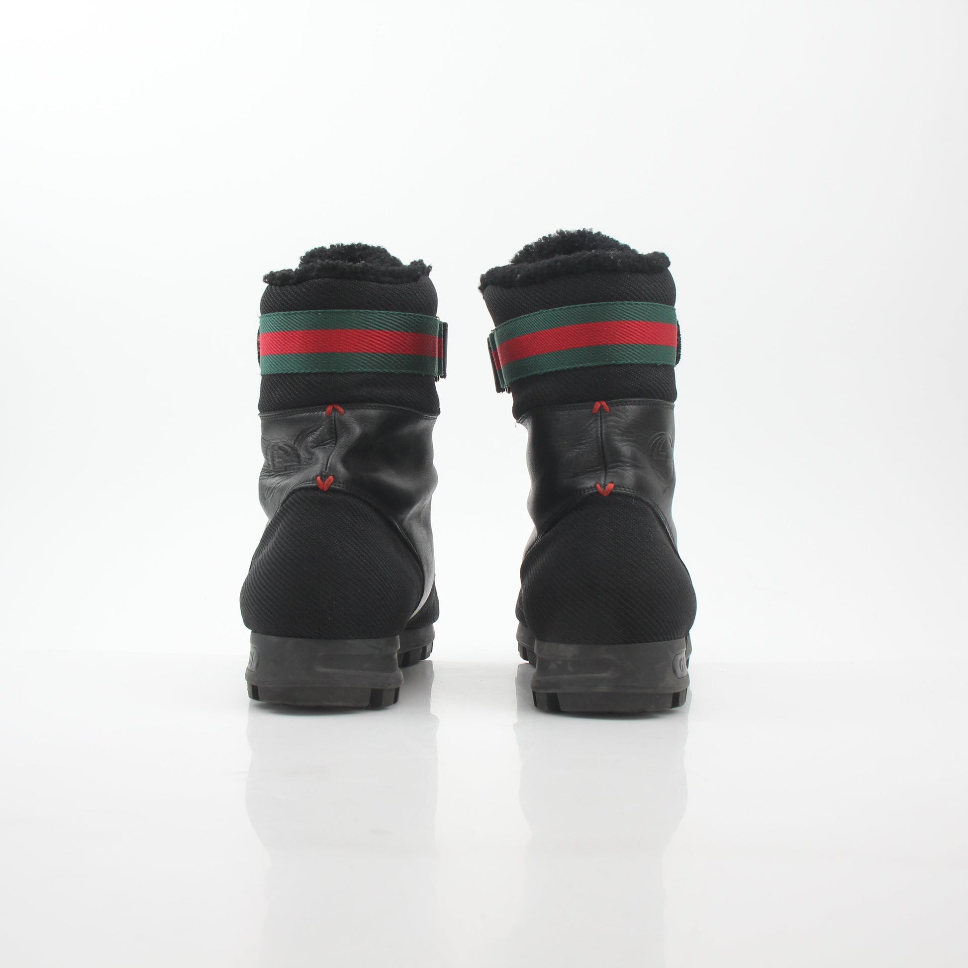 Gucci black Web accent combat boots from Gold & Beyond, stylish shoes with rugged design and signature web details.
