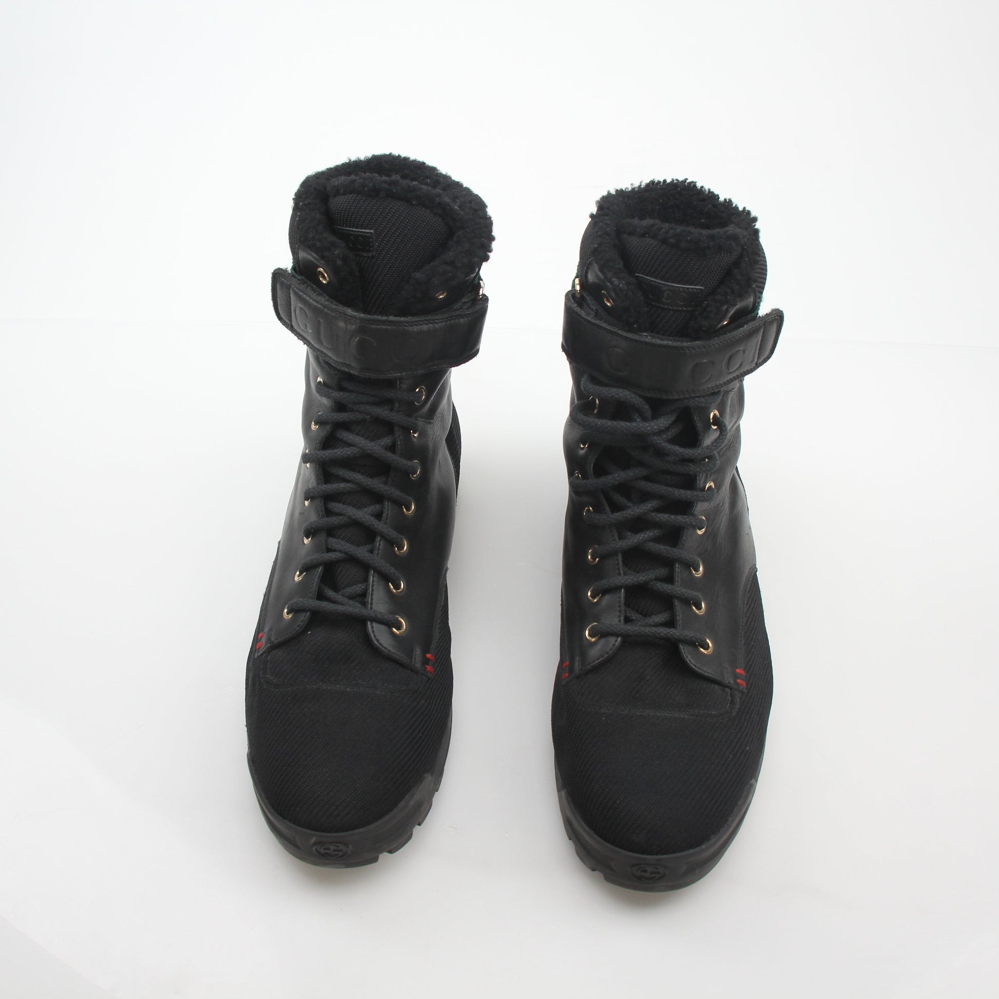 Gold & Beyond Gucci Black Web Accent Combat Boots with sturdy sole and stylish design, showcasing their bold, fashionable footwear style.
