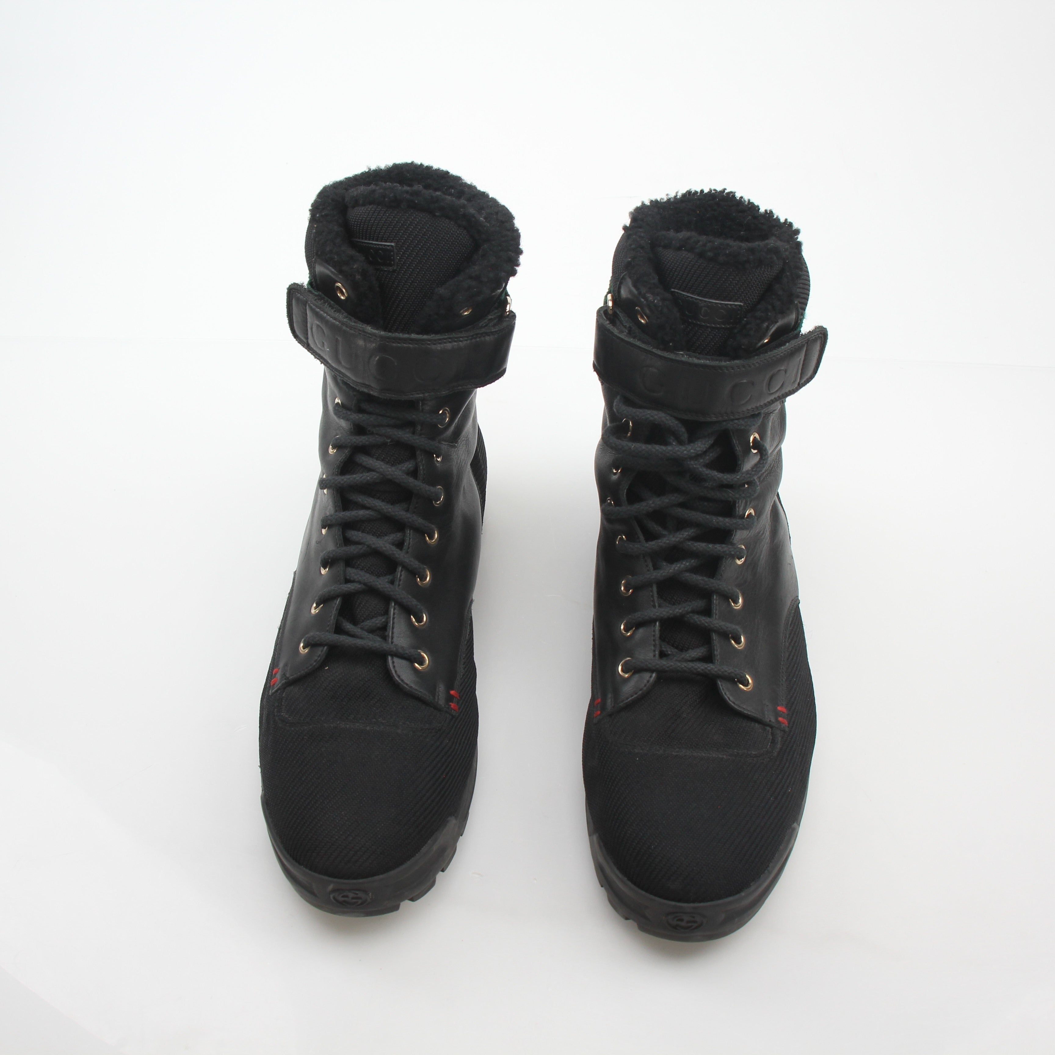 Gold & Beyond Gucci Black Web Accent Combat Boots with sturdy sole and stylish design, showcasing their bold, fashionable footwear style.