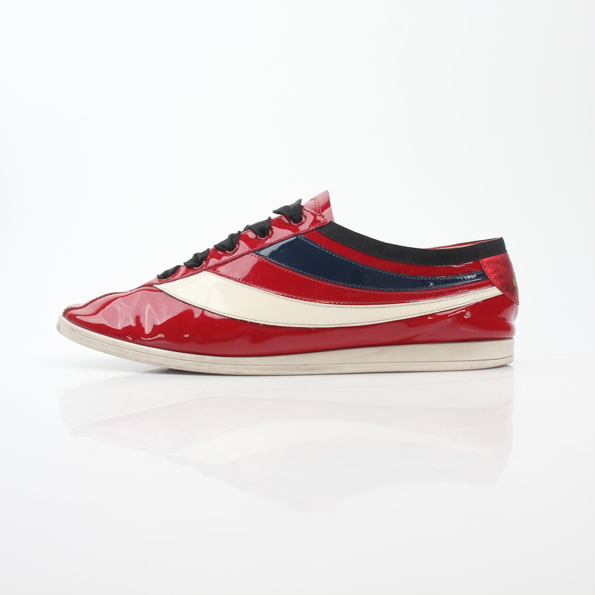 Gucci Red Falacer Hebron Web sneakers featuring red fabric, black rubber soles, and signature web stripe design.