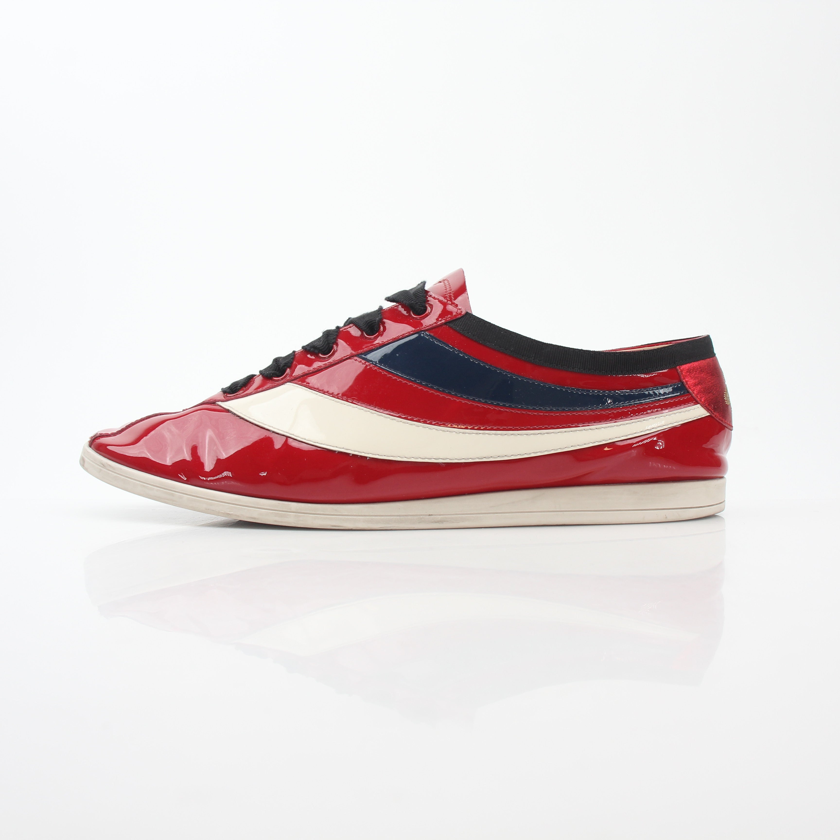 Gucci Red Falacer Hebron Web sneakers featuring red fabric, black rubber soles, and signature web stripe design.