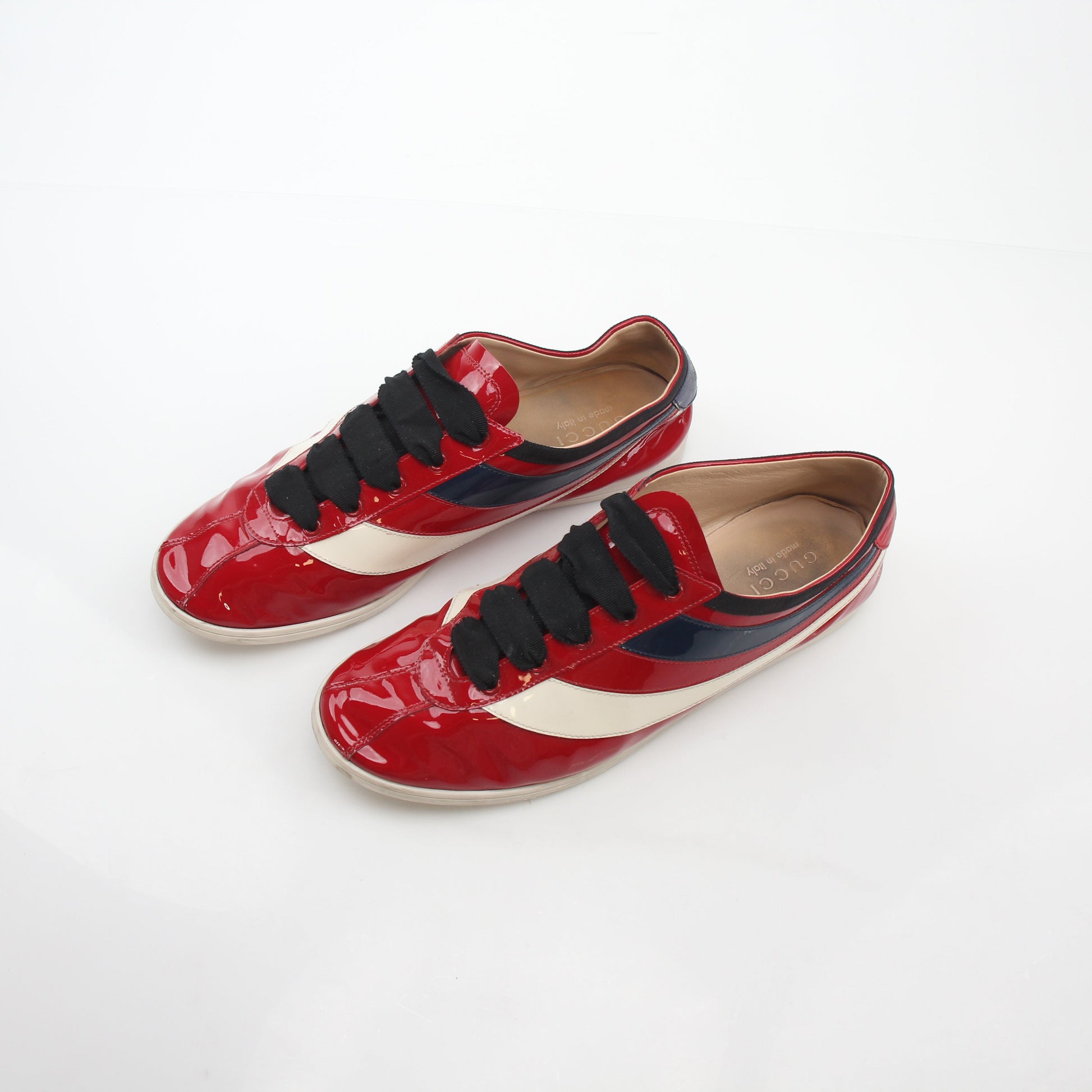 Gucci Red Falacer Hebron Web sneakers with sporty design and signature branding, displayed on a neutral background.