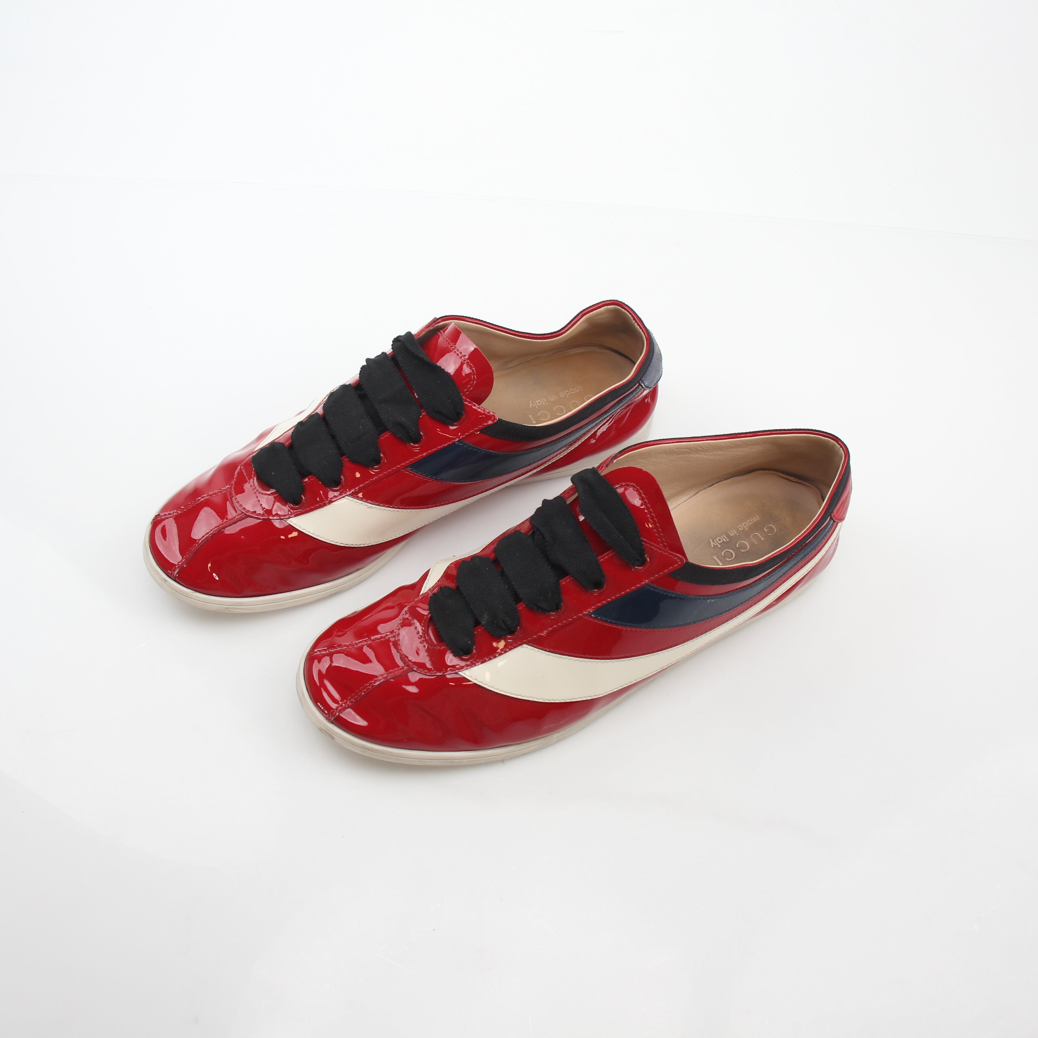 Gucci Red Falacer Hebron Web sneakers with sporty design and signature branding, displayed on a neutral background.
