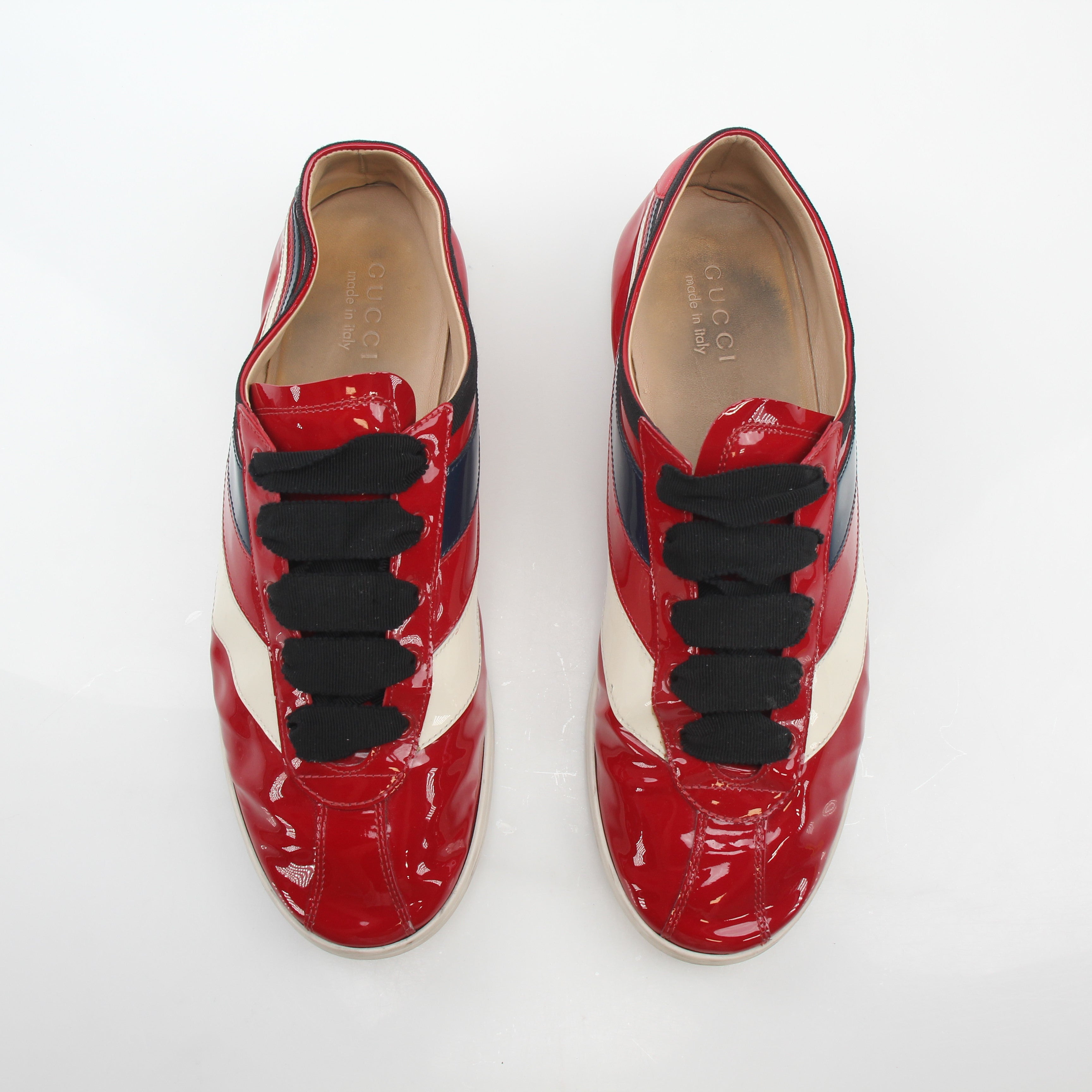 Gucci Red Falacer Hebron Web sneakers, stylish shoes with red and web detailing, displayed on a plain background