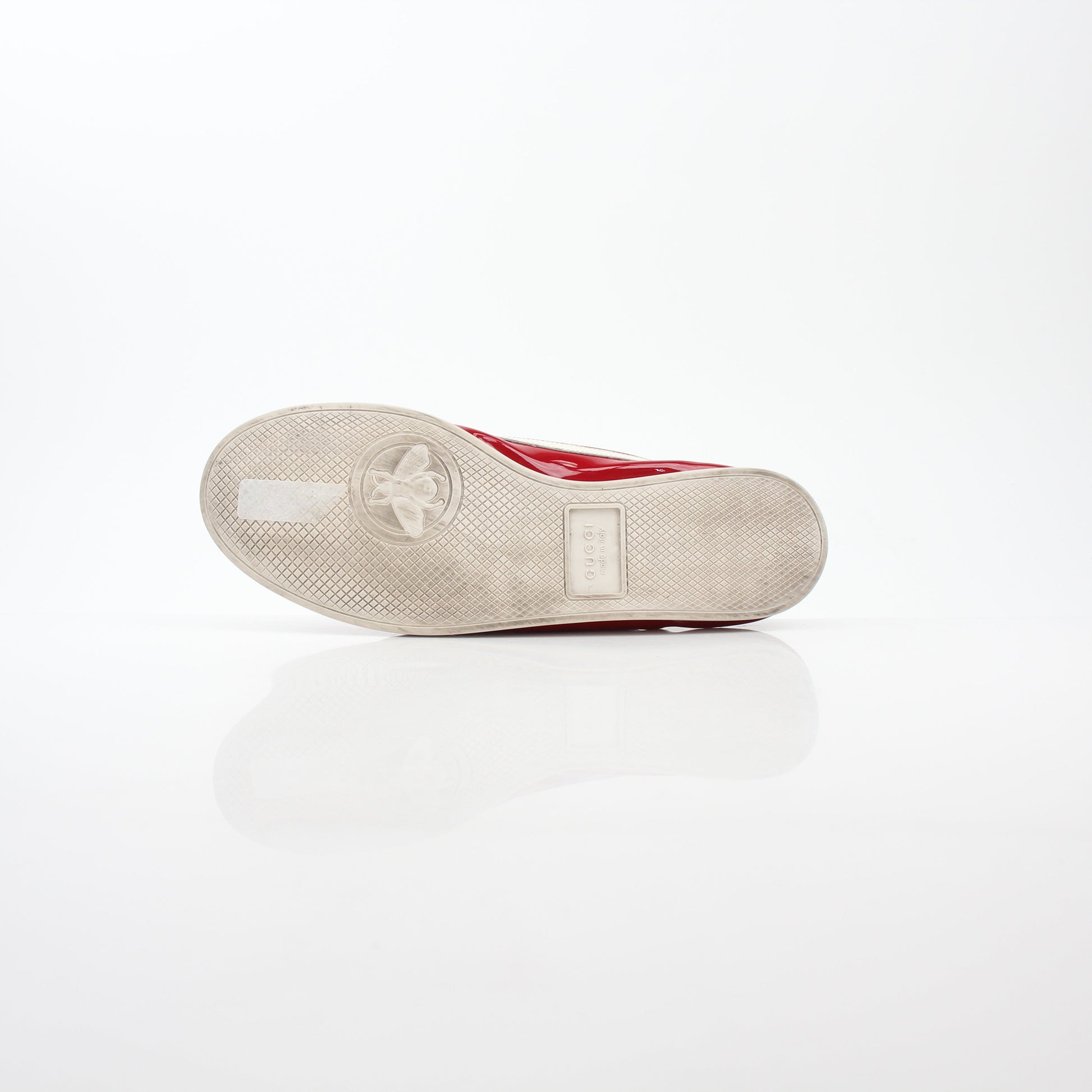 Gucci Red Falacer Hebron Web sneakers displayed on a white background, showcasing their vibrant red color and web detailing.