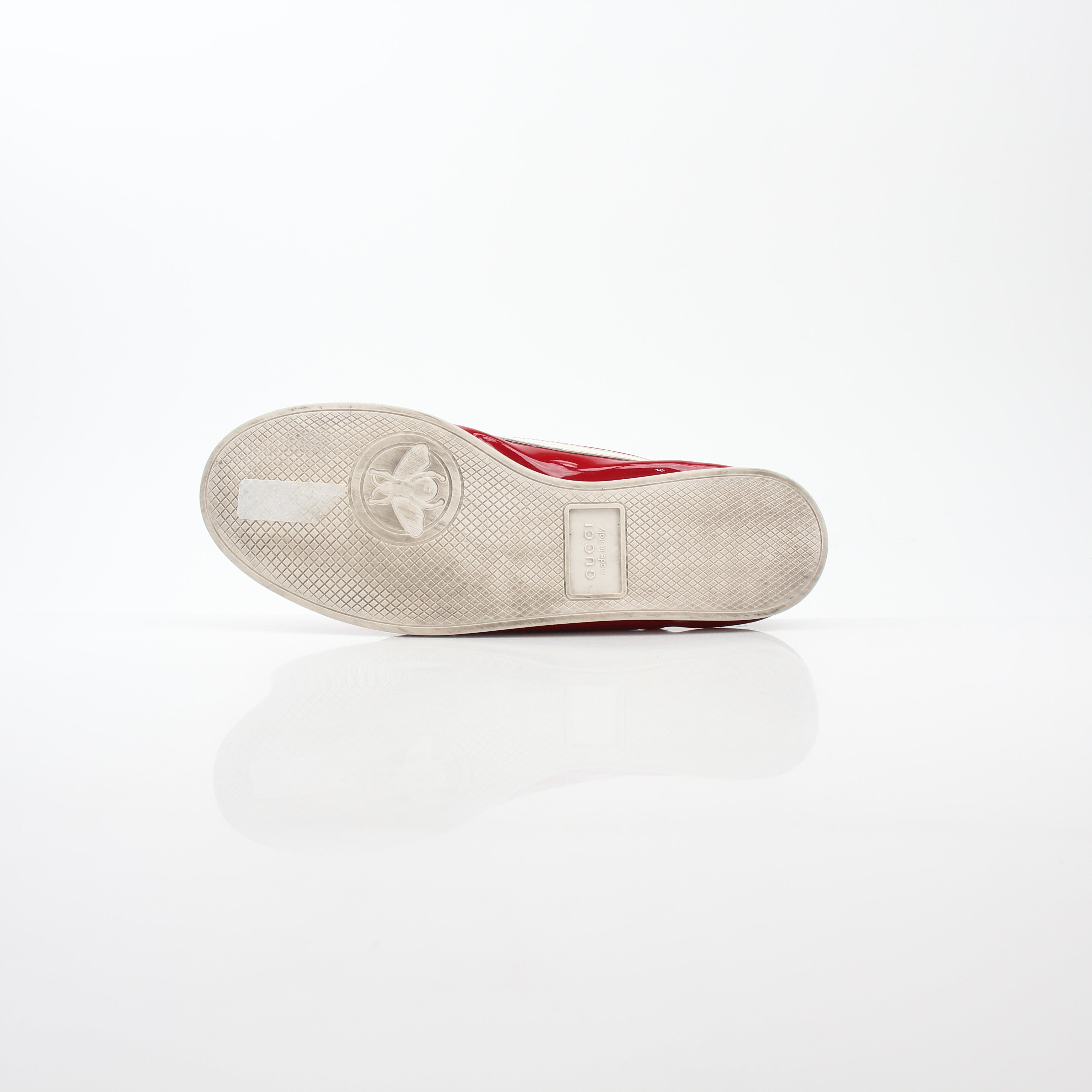 Gucci Red Falacer Hebron Web sneakers displayed on a white background, showcasing their vibrant red color and web detailing.
