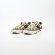 Gold & Beyond Gucci Beige GG Tennis 1977 sneakers, showing classic design with beige canvas and rubber sole detail.