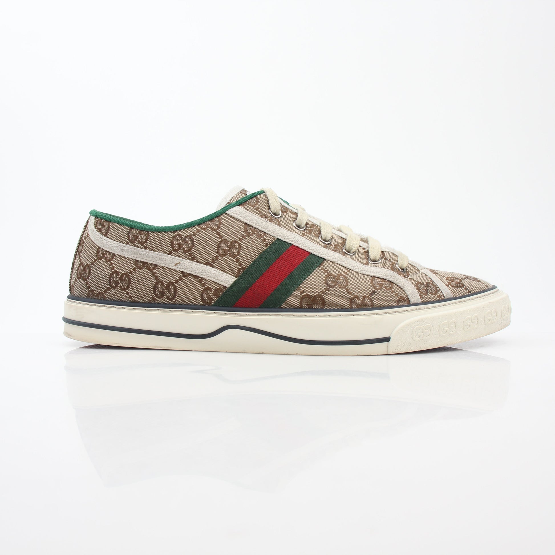 Gold & Beyond Gucci Beige GG Tennis 1977 sneakers featuring classic design, beige canvas upper, and rubber sole.