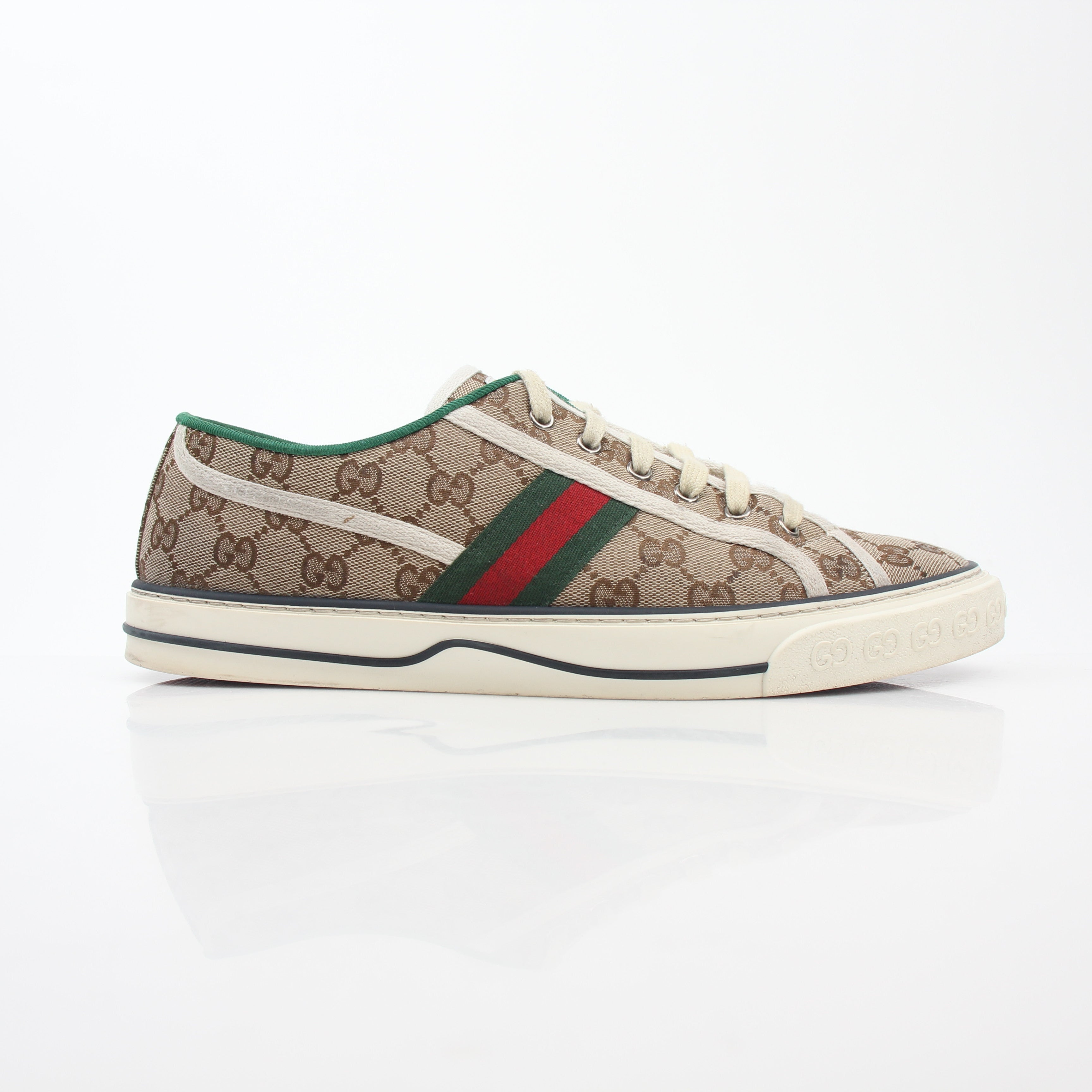Gold & Beyond Gucci Beige GG Tennis 1977 sneakers featuring classic design, beige canvas upper, and rubber sole.